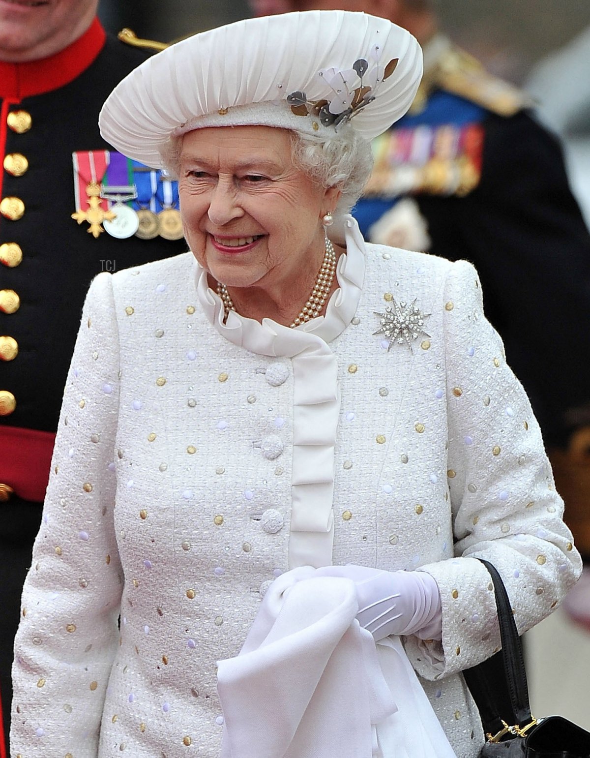 Britain's Queen Elizabeth II arrives at Chelsea harbour to embark to join the Thames Diamond Jubilee Pageant on the River Thames in London on June 3, 2012