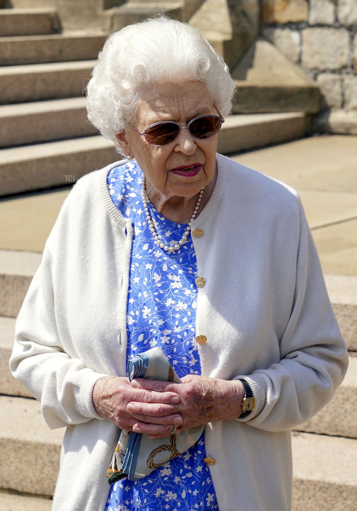 Britain's Queen Elizabeth II reacts after she was presented with a Duke of Edinburgh rose, named in memory of her late husband Prince Philip, the Duke of Edinburgh, by the President of the Royal Horticultural Society, Keith Weed (unseen), at Windsor Castle in Windsor, west of London, on June 2, 2021