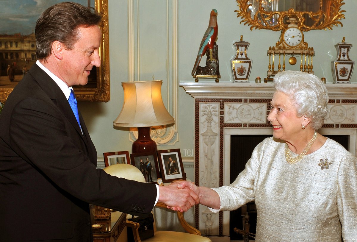 British Queen Elizabeth (R) greets Conservative party Leader David Cameron, for an audience at which she invited him to be Britain's next Prime Minister, at Buckingham Palace in central London May 11, 2010