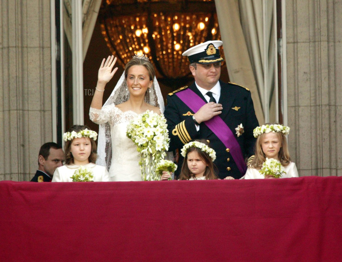 Prince Laurent of Belgium and his bride Claire Coombs wave to the crowd from the balcony of Brussels Royal Palace April 12, 2003 in Brussels, Belgium