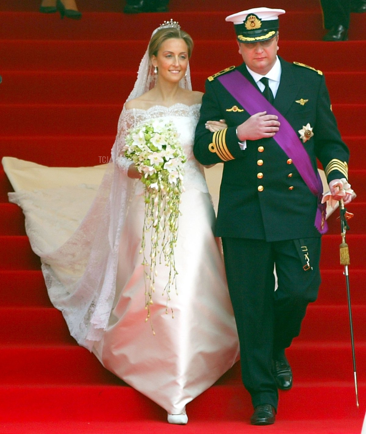 Prince Laurent of Belgium (R) and his bride Claire Coombs leave the Cathedral of St. Michael and St. Gudula after their marriage ceremony April 12, 2003 in Brussels, Belgium