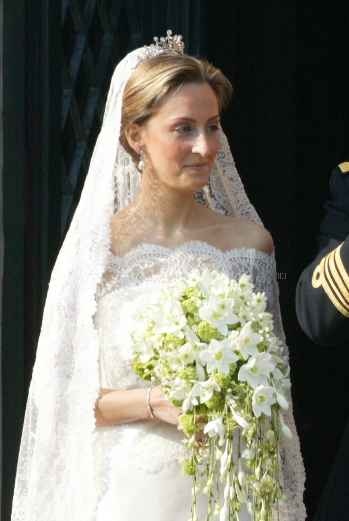 Prince Laurent of Belgium and his bride Claire Coombs wave to the crowd from the balcony of Brussels townhall April 12, 2003 in Brussels, Belgium