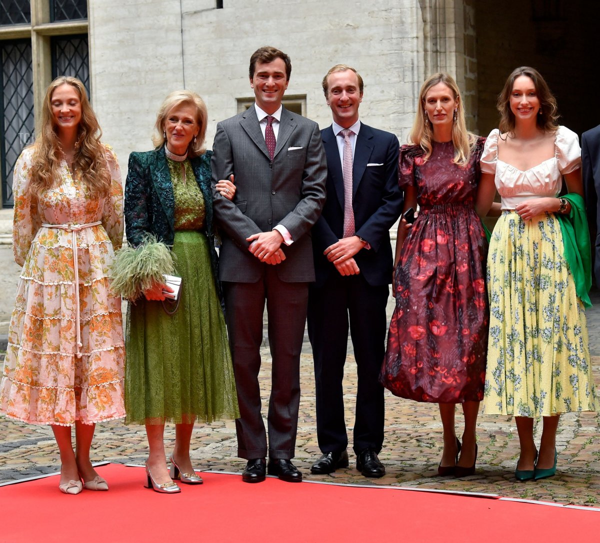 Brussel Mayor Philippe Close, Princess Luisa Maria of Belgium, Princess Astrid of Belgium, Prince Amedeo of Belgium, Prince Joachim of Belgium, Elisabetta Rosboch von Wolkenstein and Princess Laetitia Maria of Belgium pose as they arrive at the City Hall for the official wedding of Princess Maria-Laura of Belgium and William Isvy in Brussels on September 10, 2022