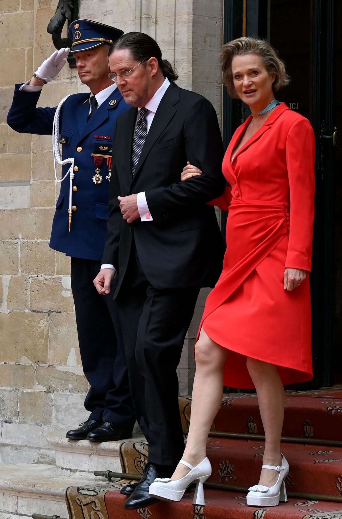 Princess Delphine of Belgium (R) and her husband Jim O'Hare (C) leave after the official wedding of Princess Maria-Laura of Belgium and William Isvy in Brussels on September 10, 2022