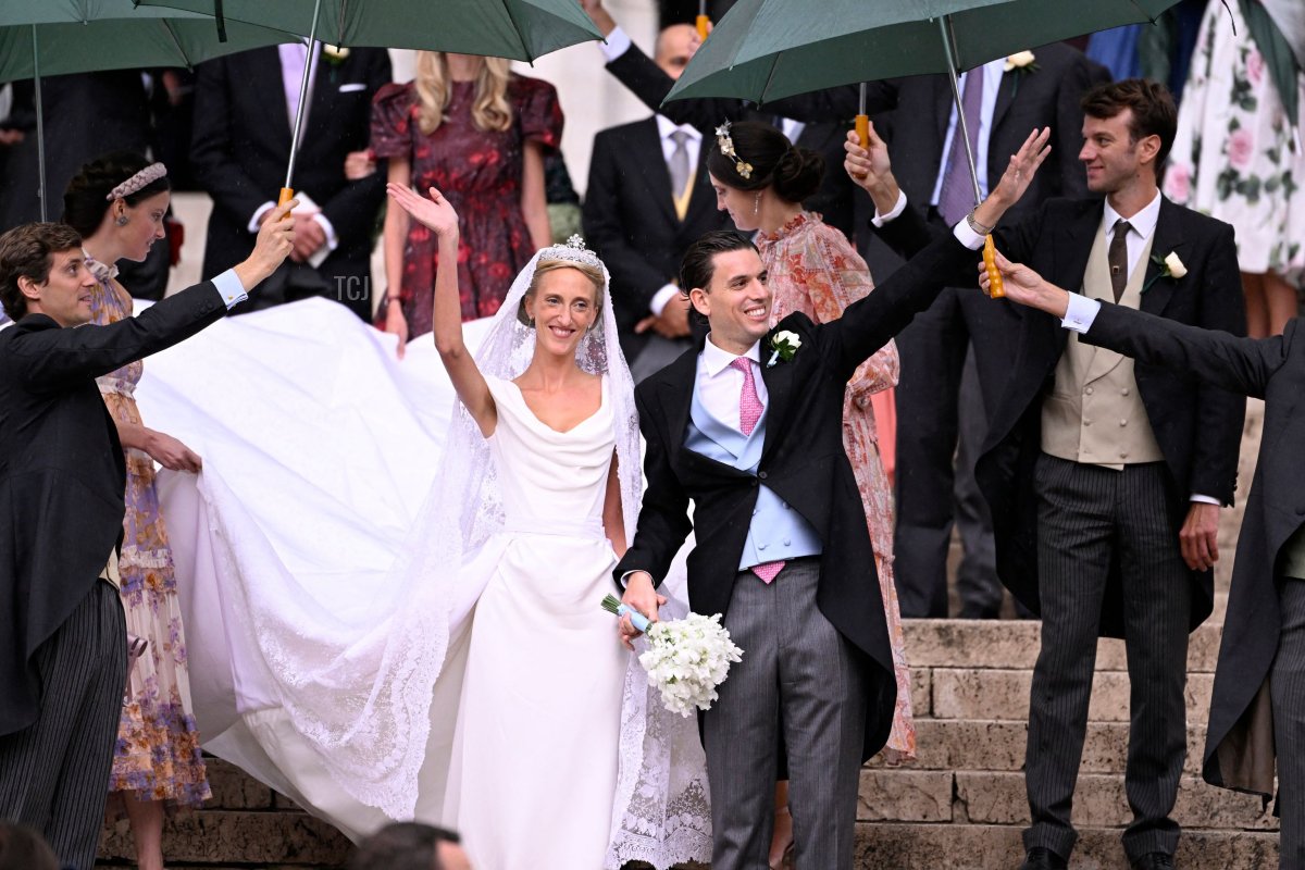 Princess Maria-Laura of Belgium and William Isvy leave after their wedding ceremony at Saint Michael and Saint Gudula Cathedral in Brussels on September 10, 2022