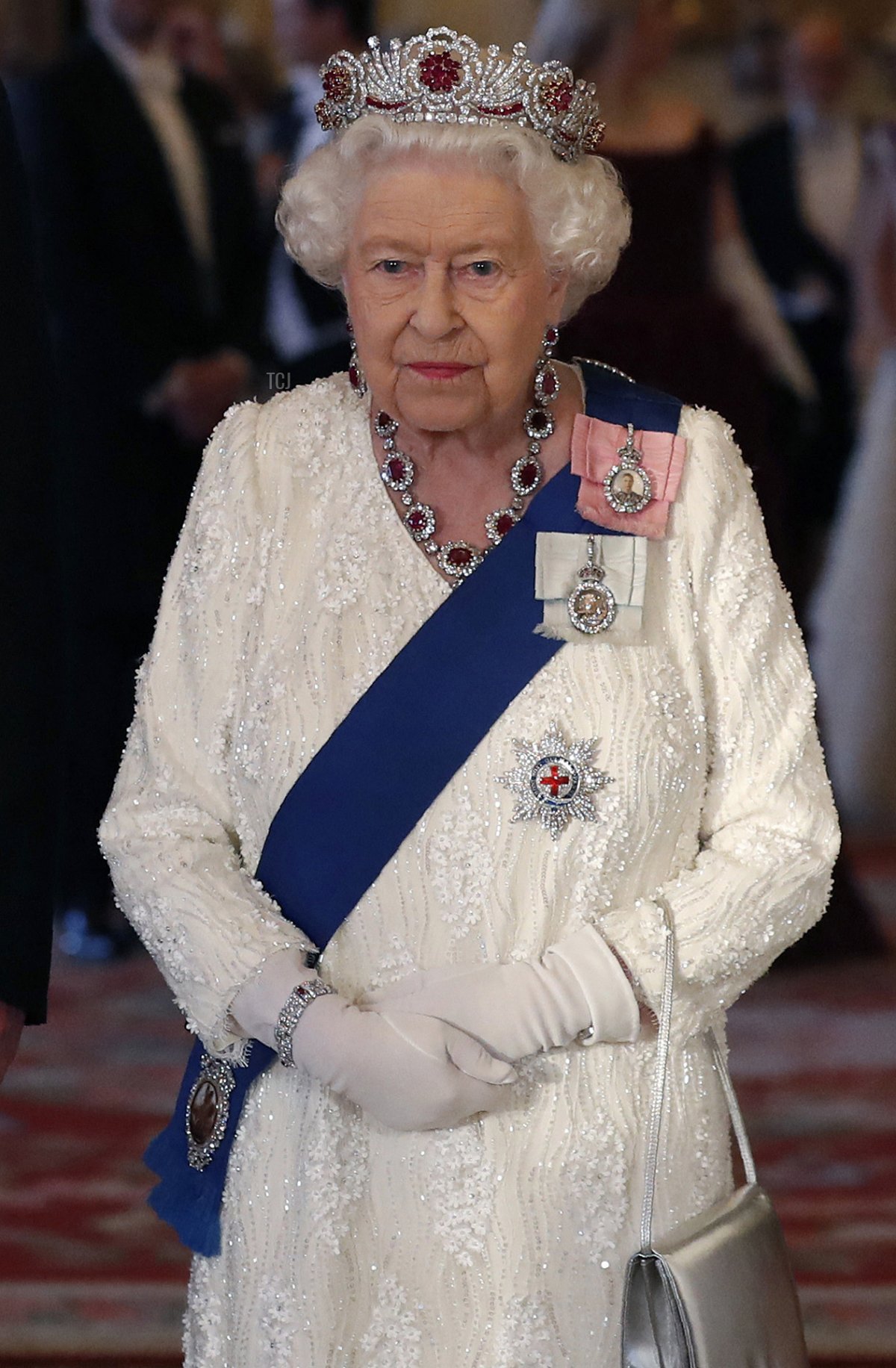 Britain's Queen Elizabeth II reacts as she poses with the US President and US First Lady ahead of a State Banquet in the ballroom at Buckingham Palace in central London on June 3, 2019, on the first day of the US president and First Lady's three-day State Visit to the UK
