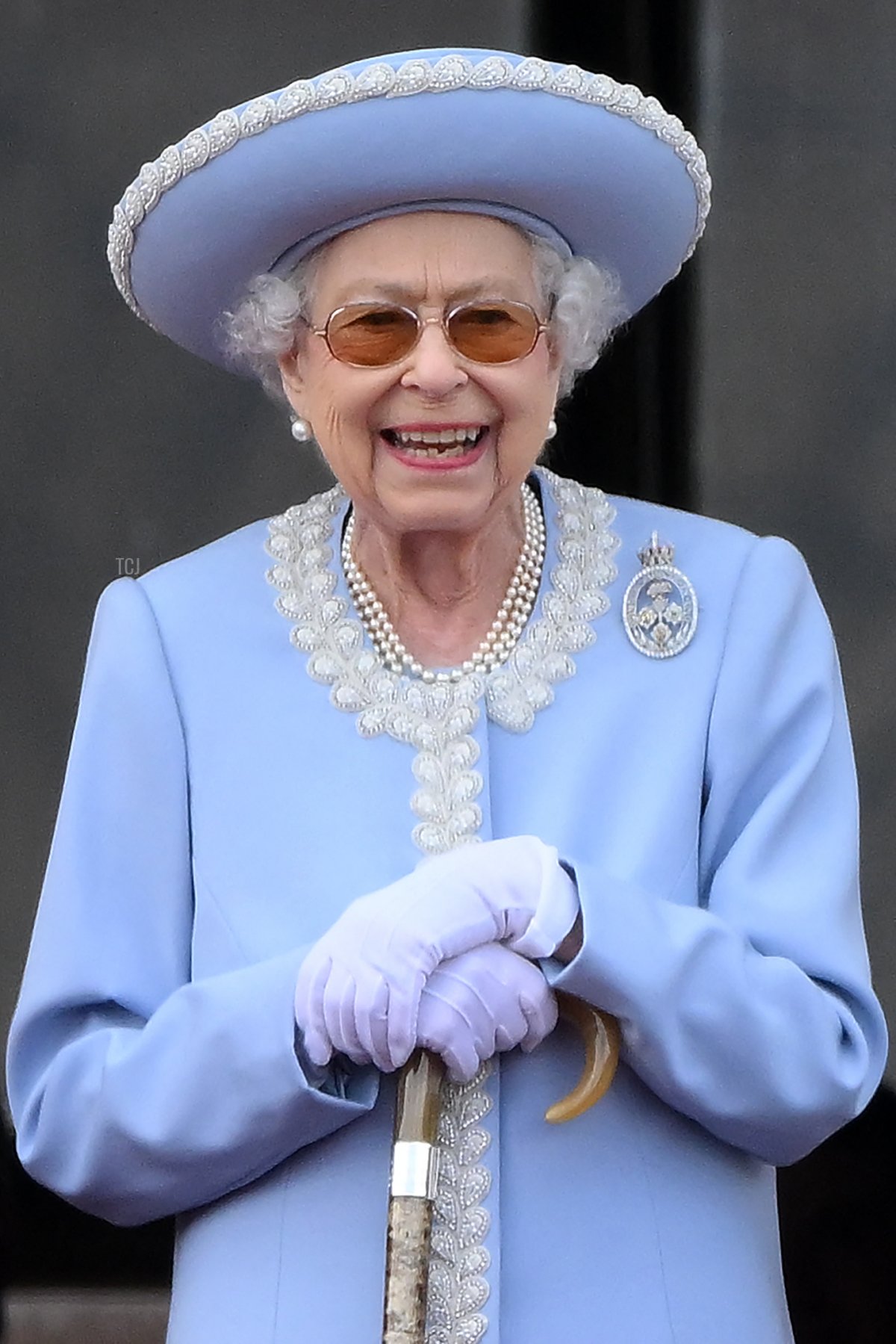 Britain's Queen Elizabeth II reacts as she watches a special flypast from Buckingham Palace balcony following the Queen's Birthday Parade, the Trooping the Colour, as part of Queen Elizabeth II's platinum jubilee celebrations, in London on June 2, 2022