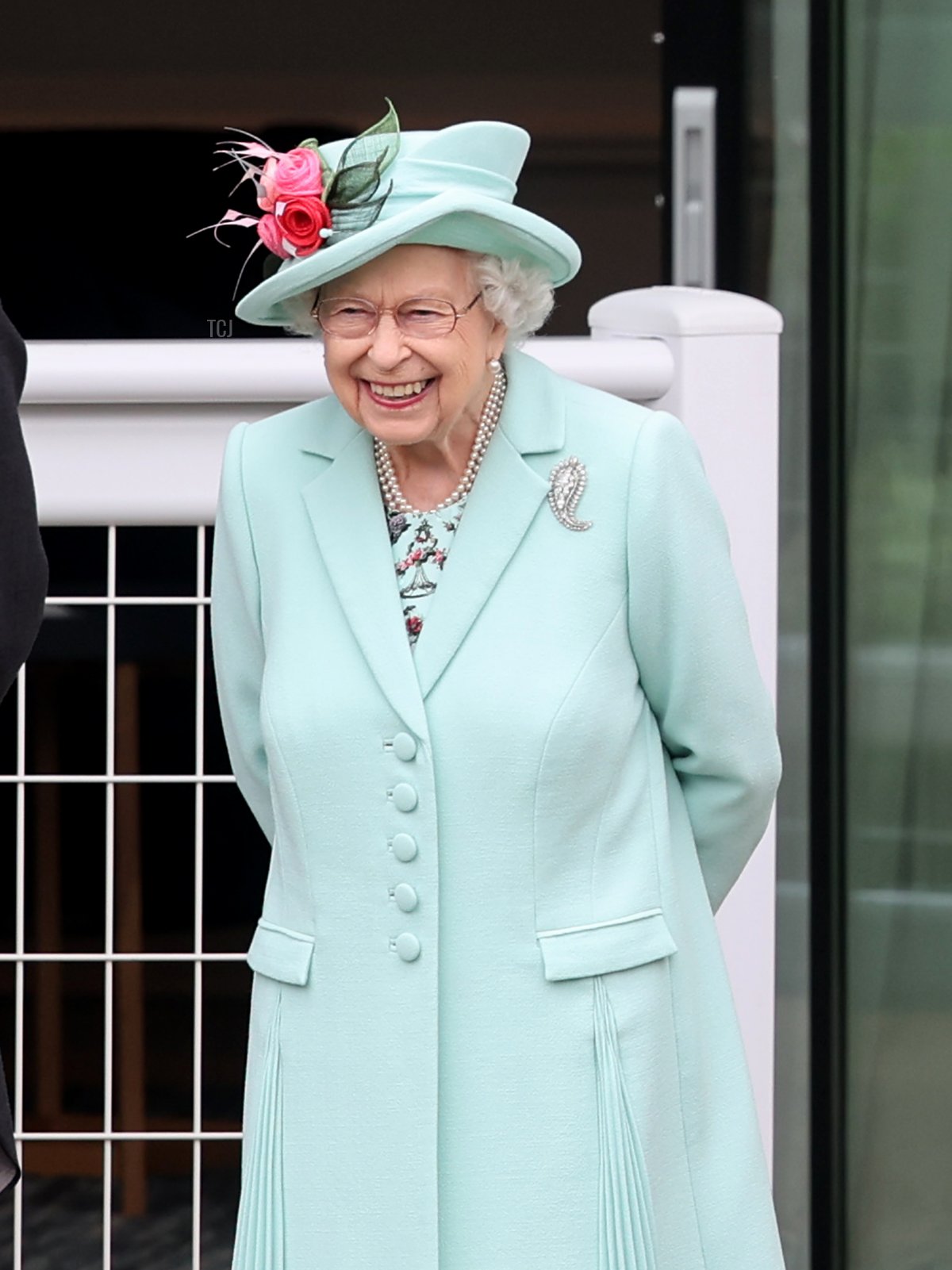Queen Elizabeth II smiles in the parade ring as she attends Royal Ascot 2021 at Ascot Racecourse on June 19, 2021 in Ascot, England