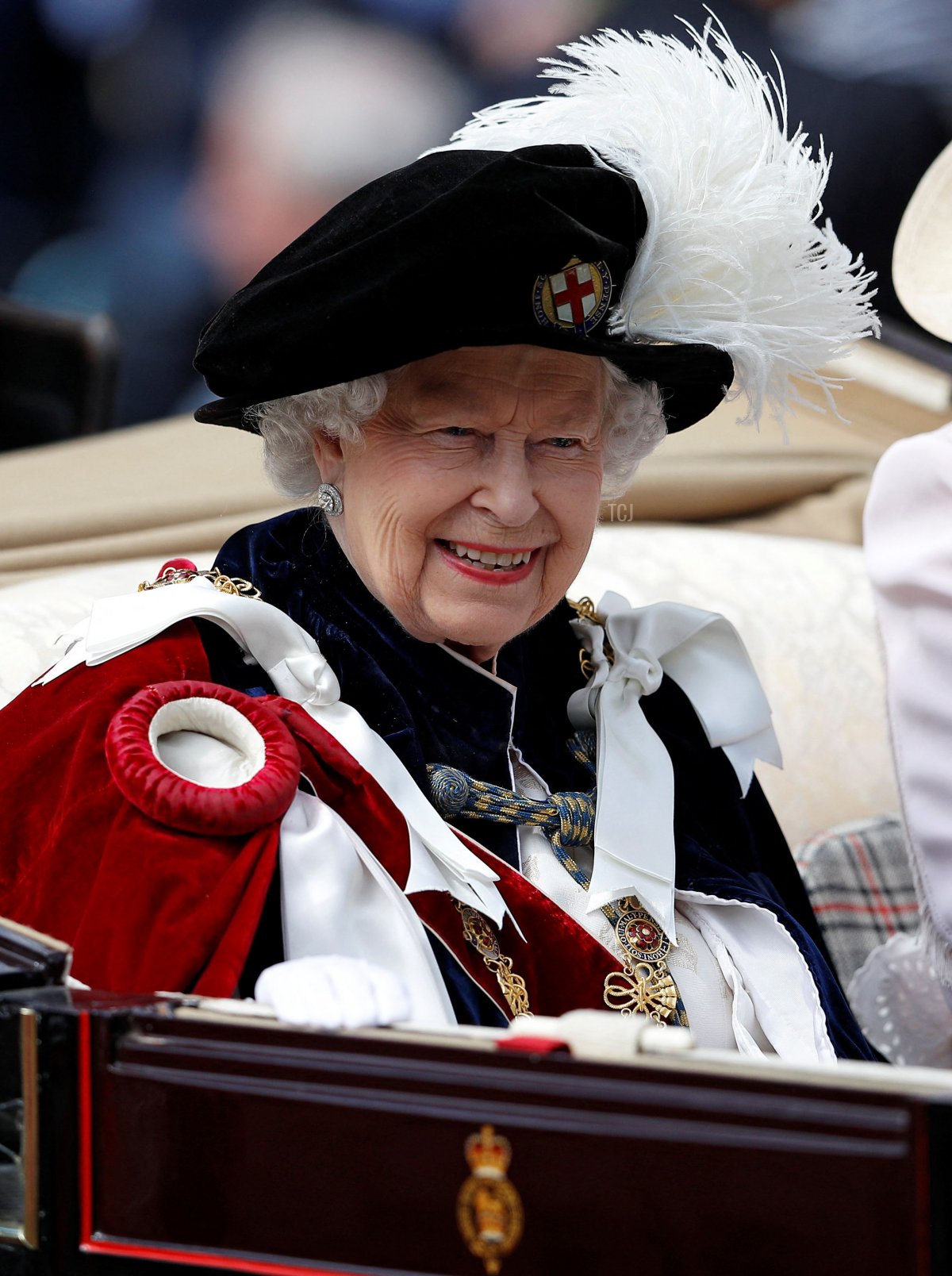 Britain's Queen Elizabeth II rides in a carriage as she leaves following the Order of the Garter Service at St George's Chapel in Windsor Castle on June 17, 2019