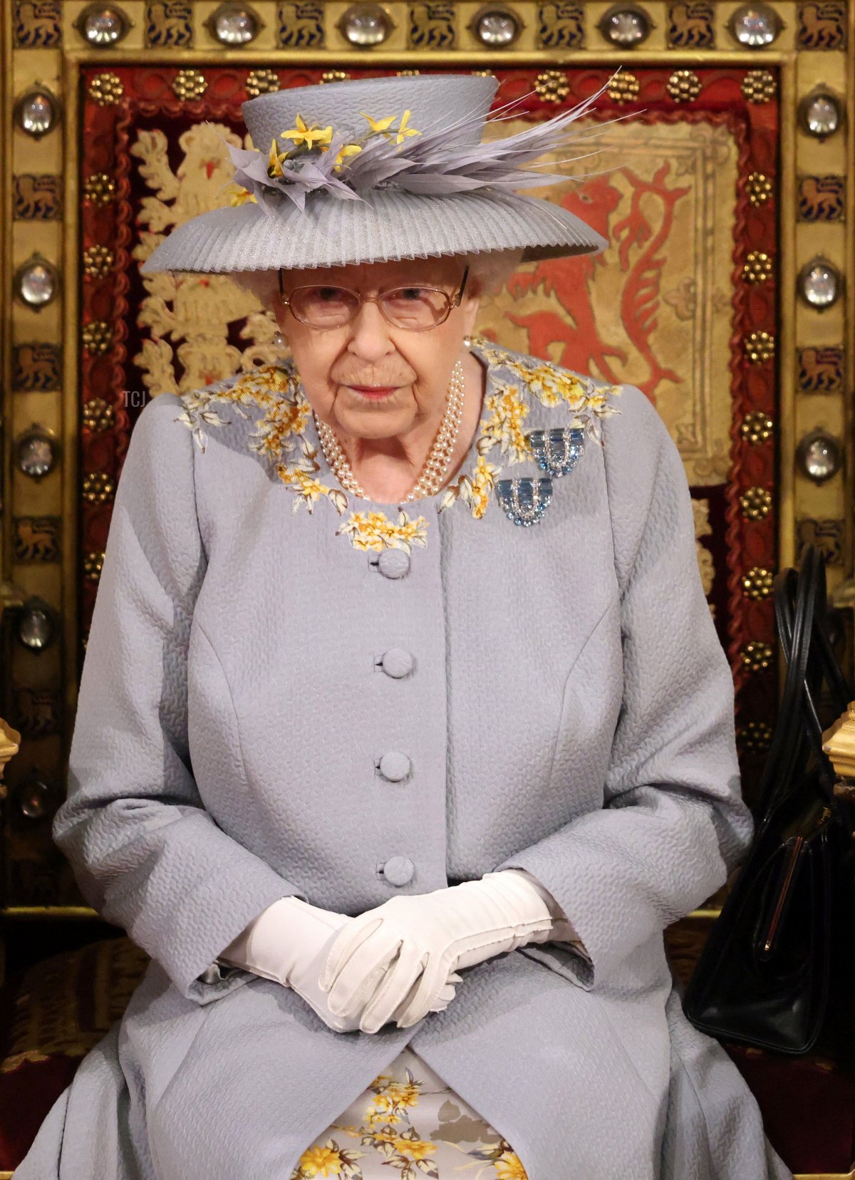 Britain's Queen Elizabeth II waits to read the Queen's Speech on the The Sovereign's Throne in the House of Lords chamber, during the State Opening of Parliament at the Houses of Parliament in London on May 11, 2021, which is taking place with a reduced capacity due to Covid-19 restrictions