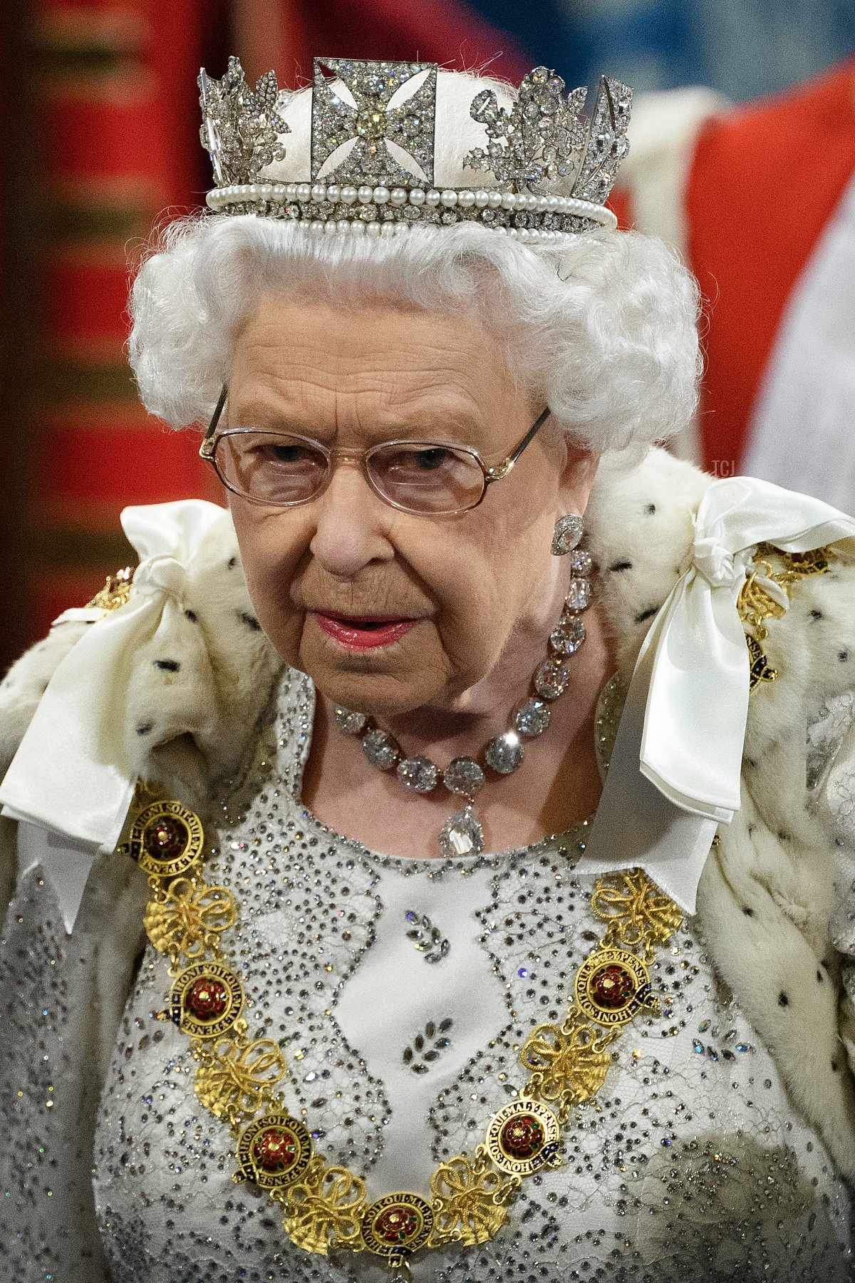 Queen Elizabeth II proceeds through the Royal Gallery before the Queen's speech during the State Opening of Parliament at the Palace of Westminster on October 14, 2019 in London, England