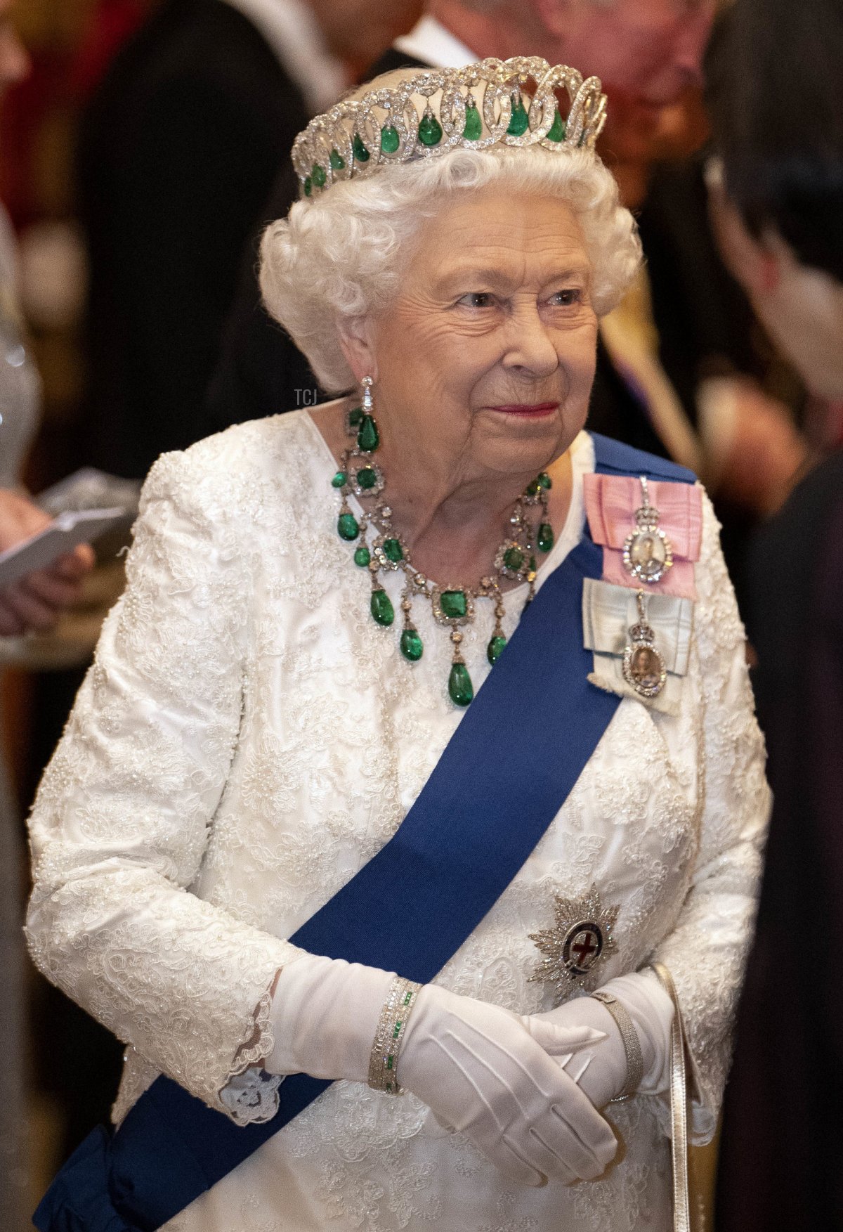 Queen Elizabeth II talks to guests at an evening reception for members of the Diplomatic Corps at Buckingham Palace on December 11, 2019 in London, England