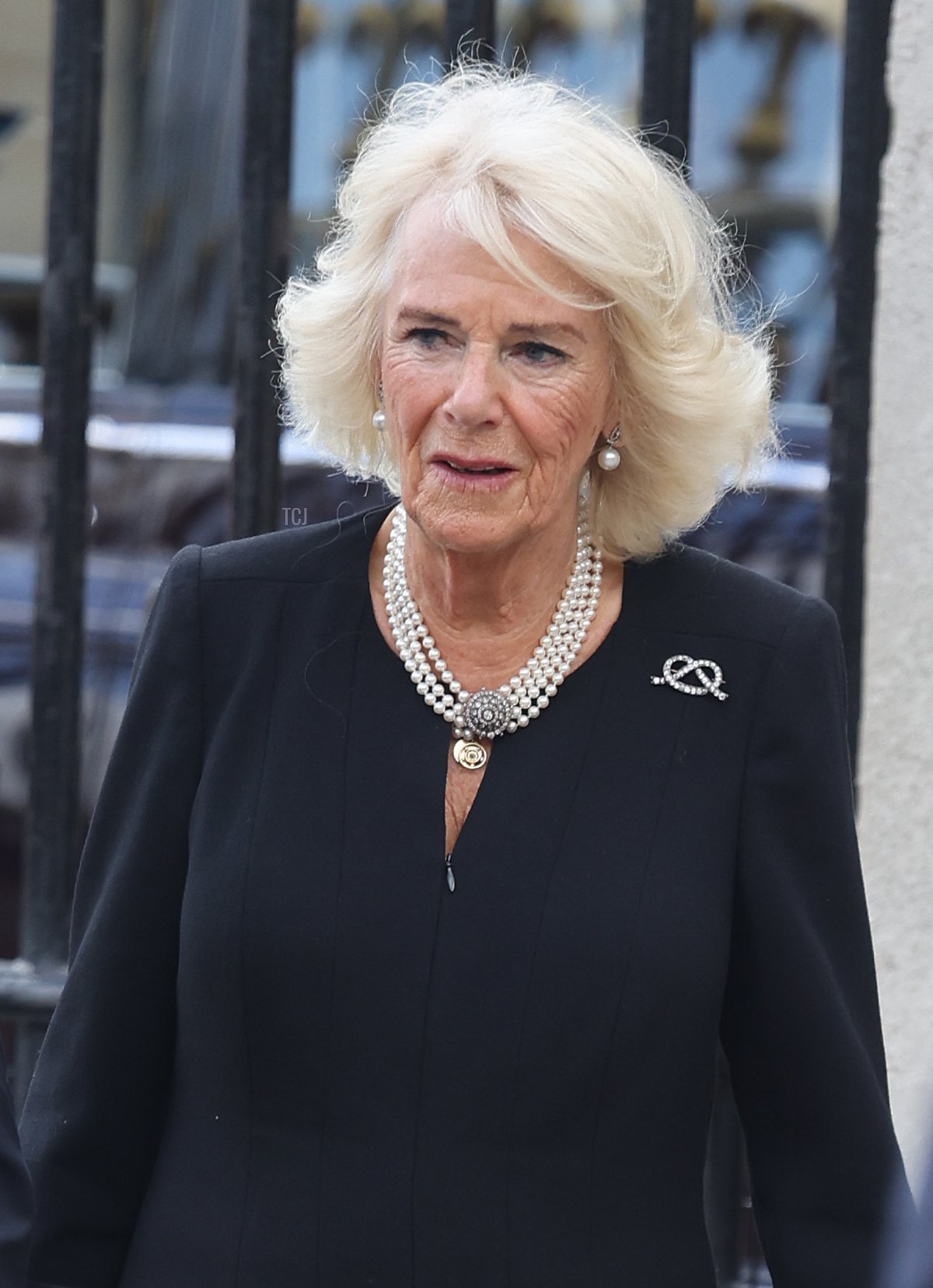 King Charles III and Camilla, Queen Consort view floral tributes to the late Queen Elizabeth II outside Buckingham Palace on September 09, 2022 in London, United Kingdom