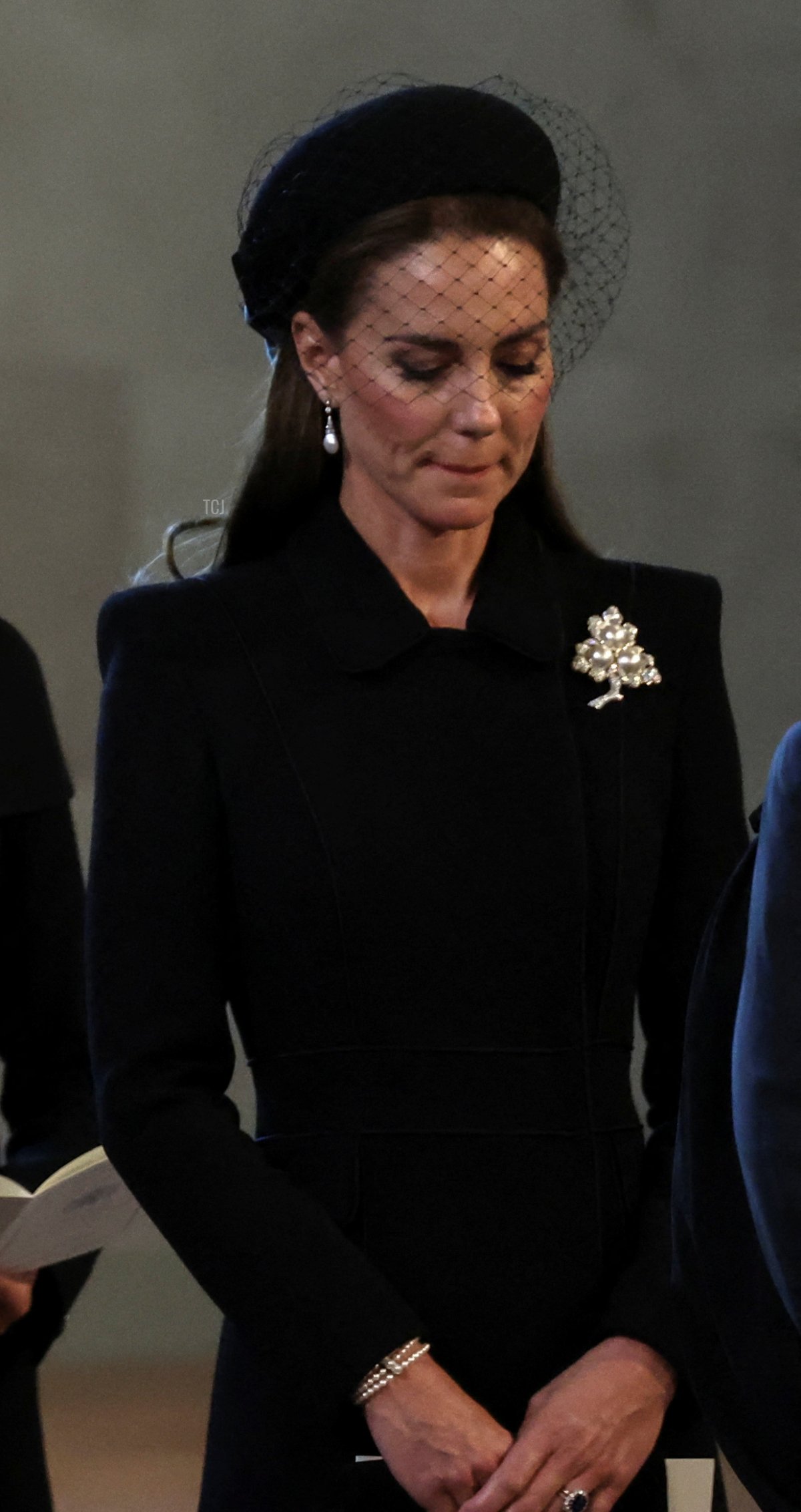 Peter Phillips, Prince Harry, Duke of Sussex, Prince William, Prince of Wales, Prince Edward, Earl of Wessex, Catherine, Princess of Wales, pay their respects during the ceremonial procession of the coffin of Queen Elizabeth II from Buckingham Palace to Westminster Hall on September 14, 2022 in London, United Kingdom