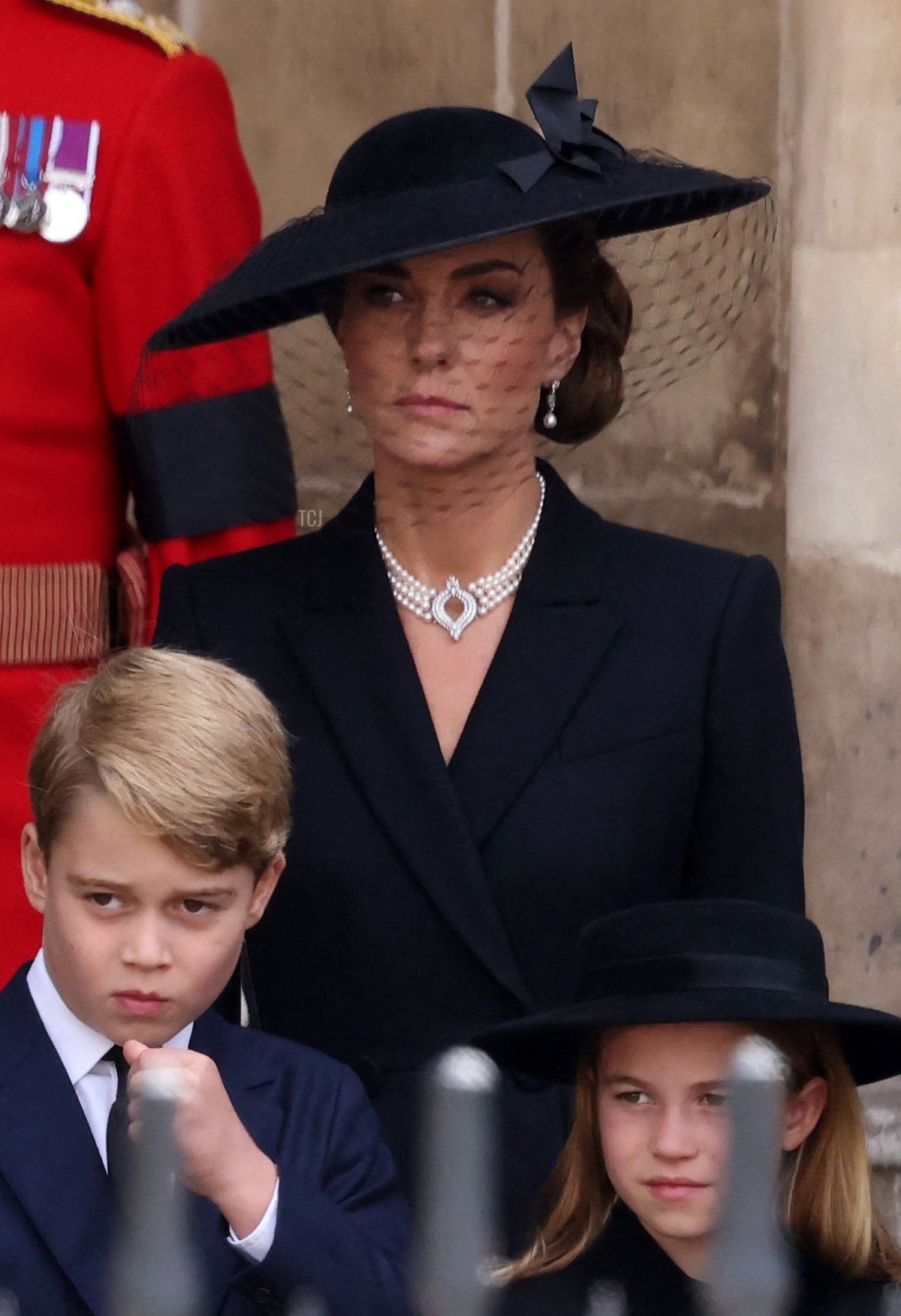 Meghan, Duchess of Sussex, Britain's Camilla, Queen Consort, Britain's Prince George of Wales, Britain's Catherine, Princess of Wales and Britain's Princess Charlotte of Wales look at the coffin of Queen Elizabeth II, draped in a Royal Standard and adorned with the Imperial State Crown and the Sovereign's orb and sceptre, as they leave Westminster Abbey in London on September 19, 2022, after the State Funeral Service for Britain's Queen Elizabeth II