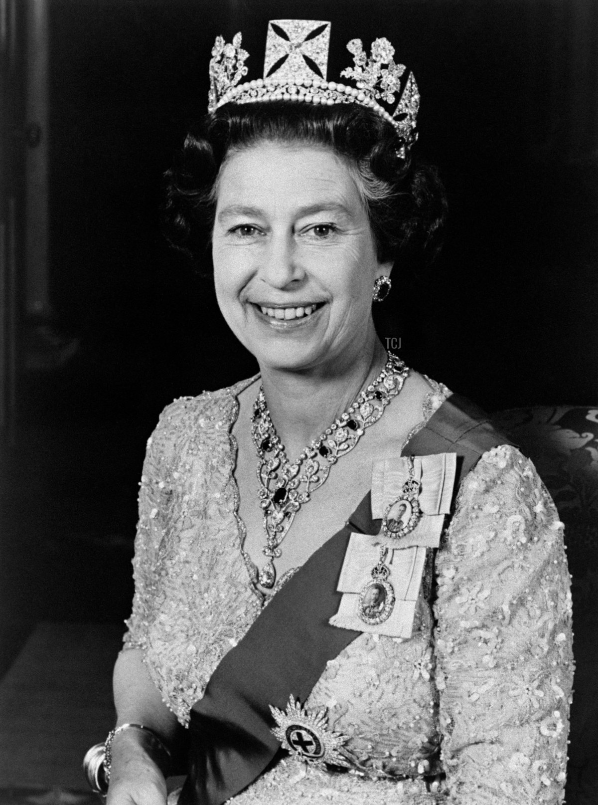 Official portrait released in June 1987 and taken at Buckingham Palace shows Britain's Queen Elizabeth II, wearing a gold lame gown with an early 19th Century diadem made for George IV