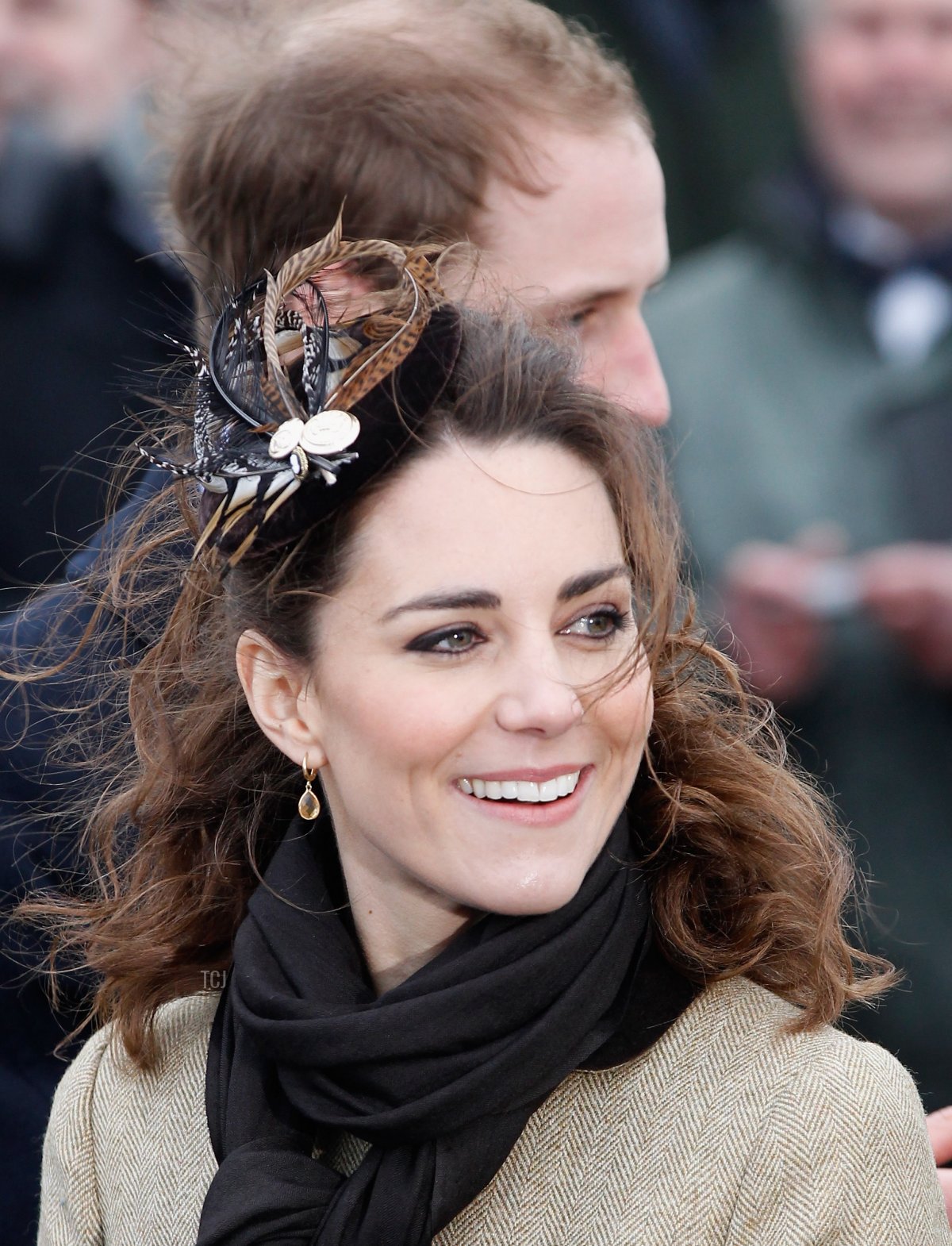 Prince William and Kate Middleton wave to the crowds after officially launching the new RNLI's lifeboat 'Hereford Endeavour' at Trearddur Bay, Anglesey on February 24, 2011 in Trearddur, Wales