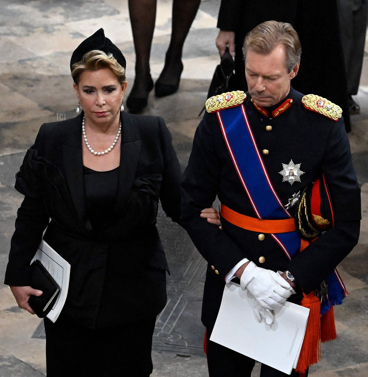 Grand Duchess, Maria Teresa (L) and Grand Duke, Henri of Luxembourg depart Westminster Abbey during the State Funeral of Queen Elizabeth II on September 19, 2022 in London, England