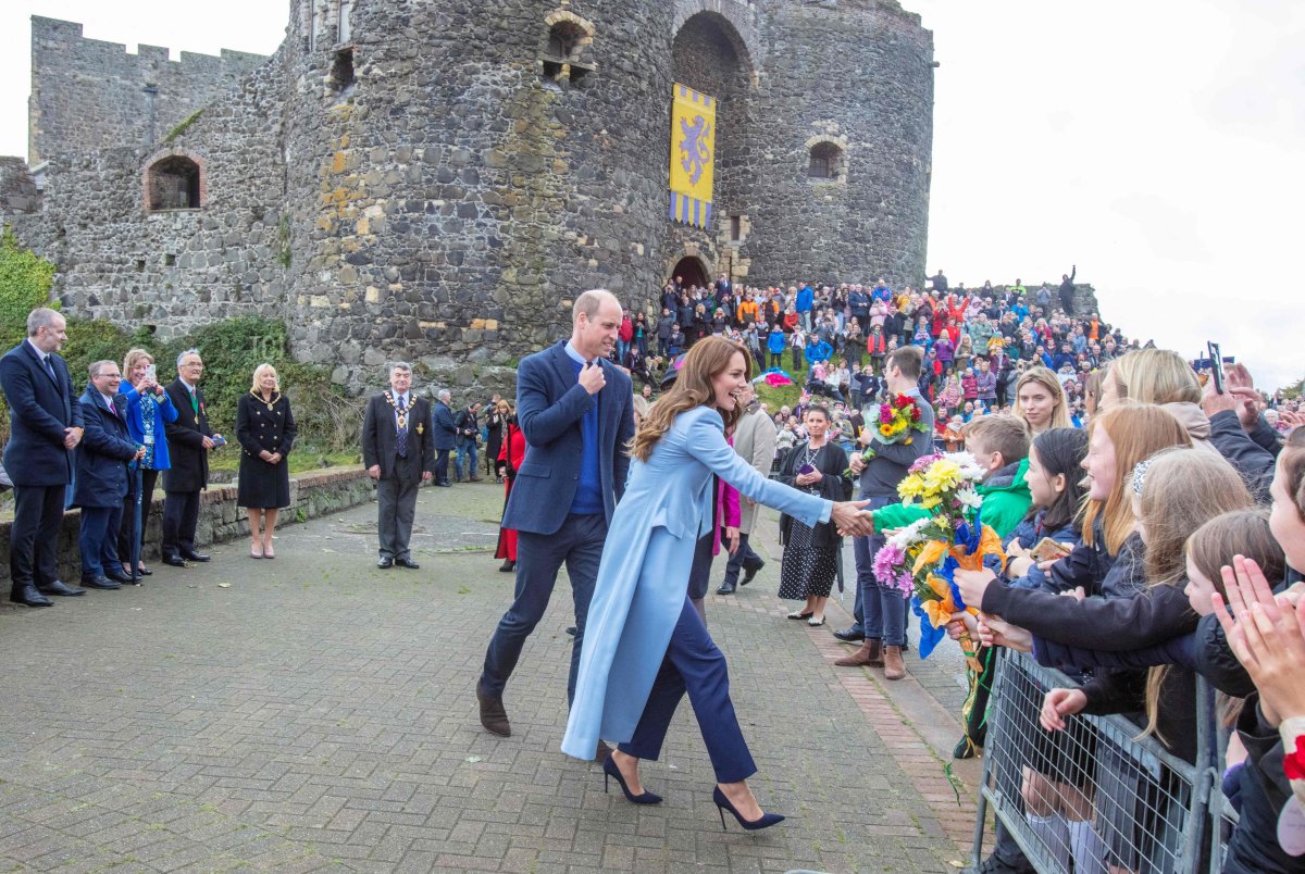 Britain's Catherine, Princess of Wales and Britain's Prince William, Prince of Wales meet with members of the public during a walkabout in Carrickfergus, as part of a visit to Northern Ireland, on October 6, 2022