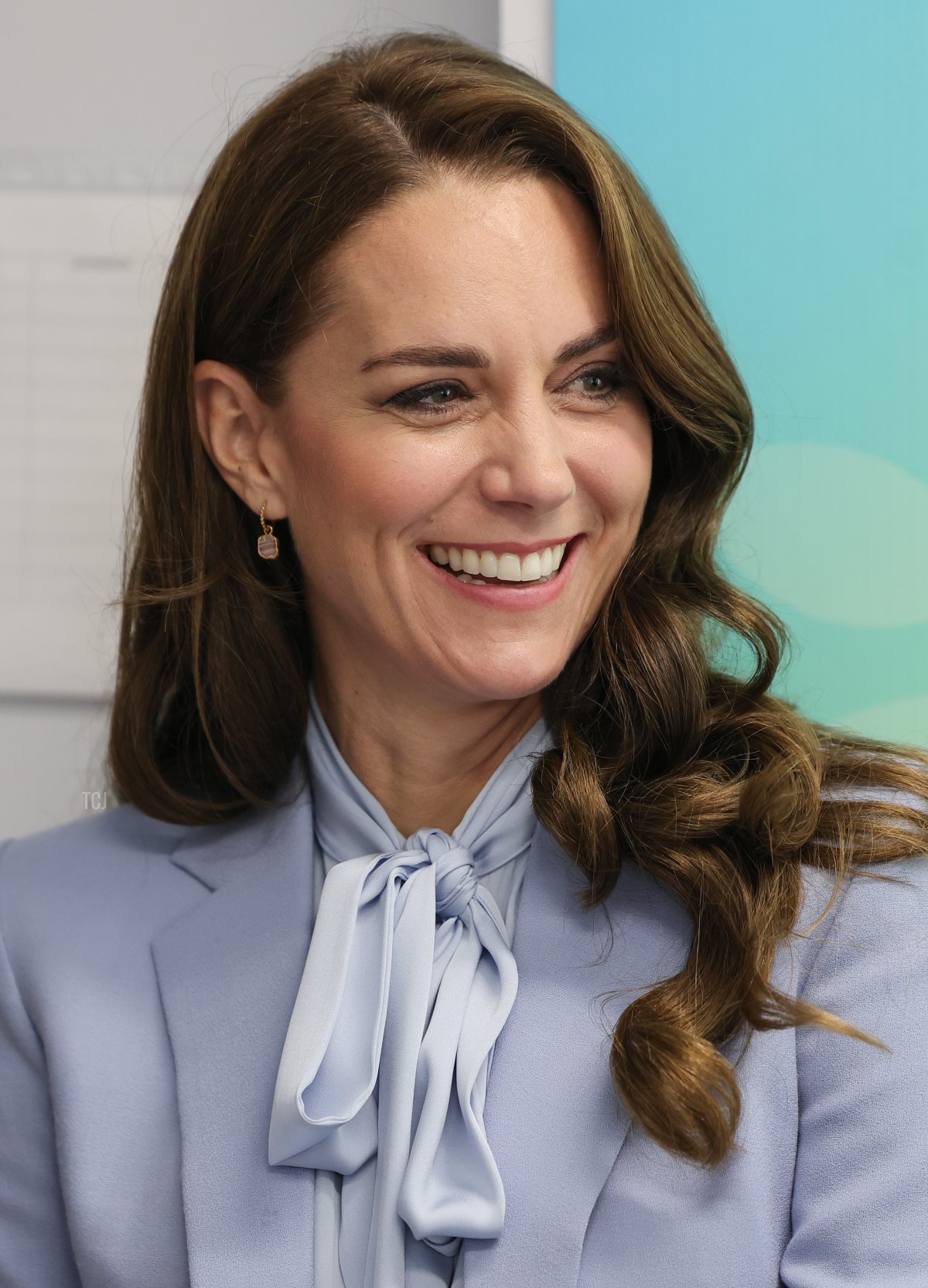 Catherine, Princess of Wales smiles as she speaks with staff during her visit to the PIPS (Public Initiative for Prevention of Suicide and Self Harm) charity with Prince William, Prince of Wales on October 06, 2022 in Belfast, Northern Ireland