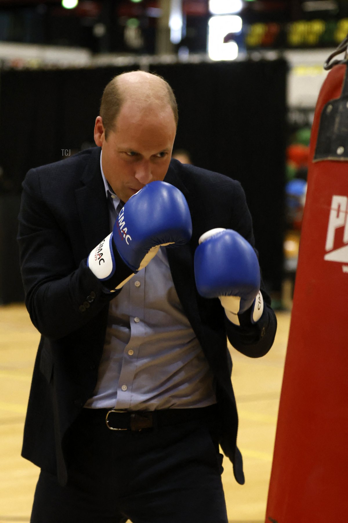 Britain's William, Prince of Wales, trains in boxing gloves during a visit to Copper Box Arena to celebrate the 10th anniversary of Coach Core in London on October 13, 2022