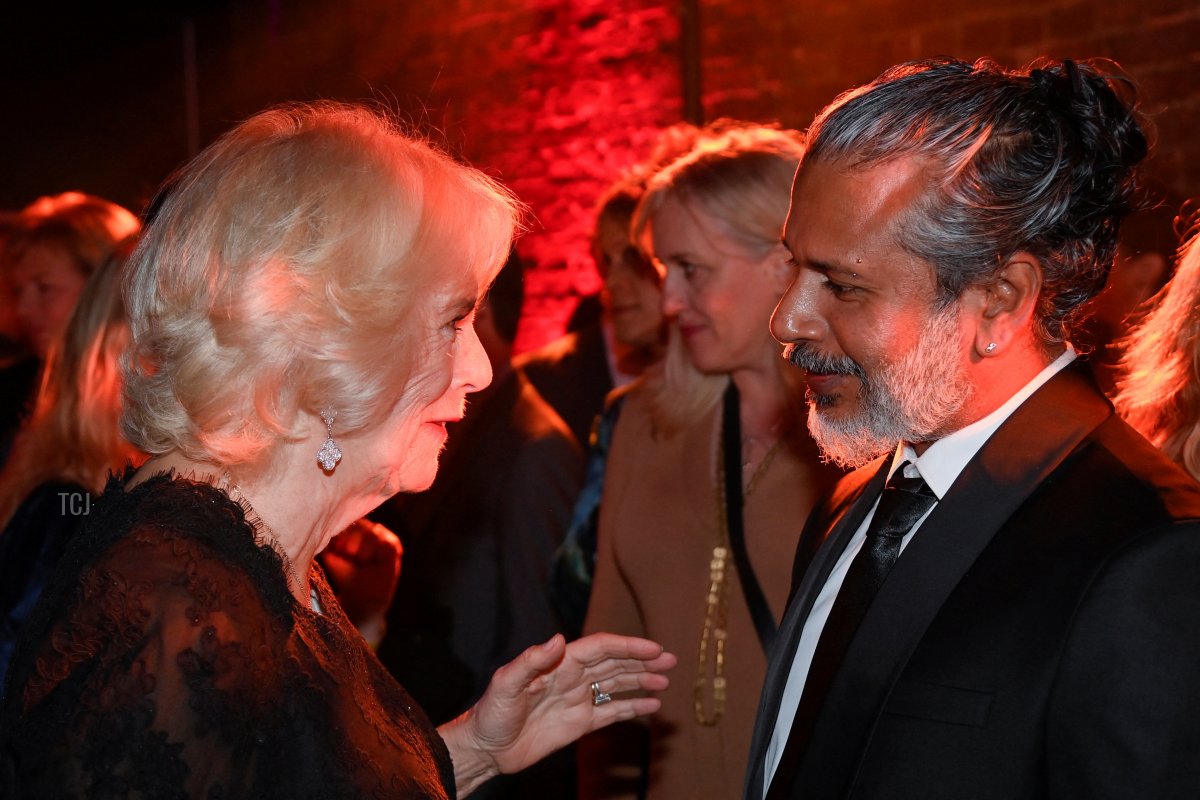 Britain's Queen Consort Camilla speaks with shortlisted author Shehan Karunatilaka at the 2022 Booker Prize for Fiction ceremony at the Roundhouse, on October 17, 2022, in London, England