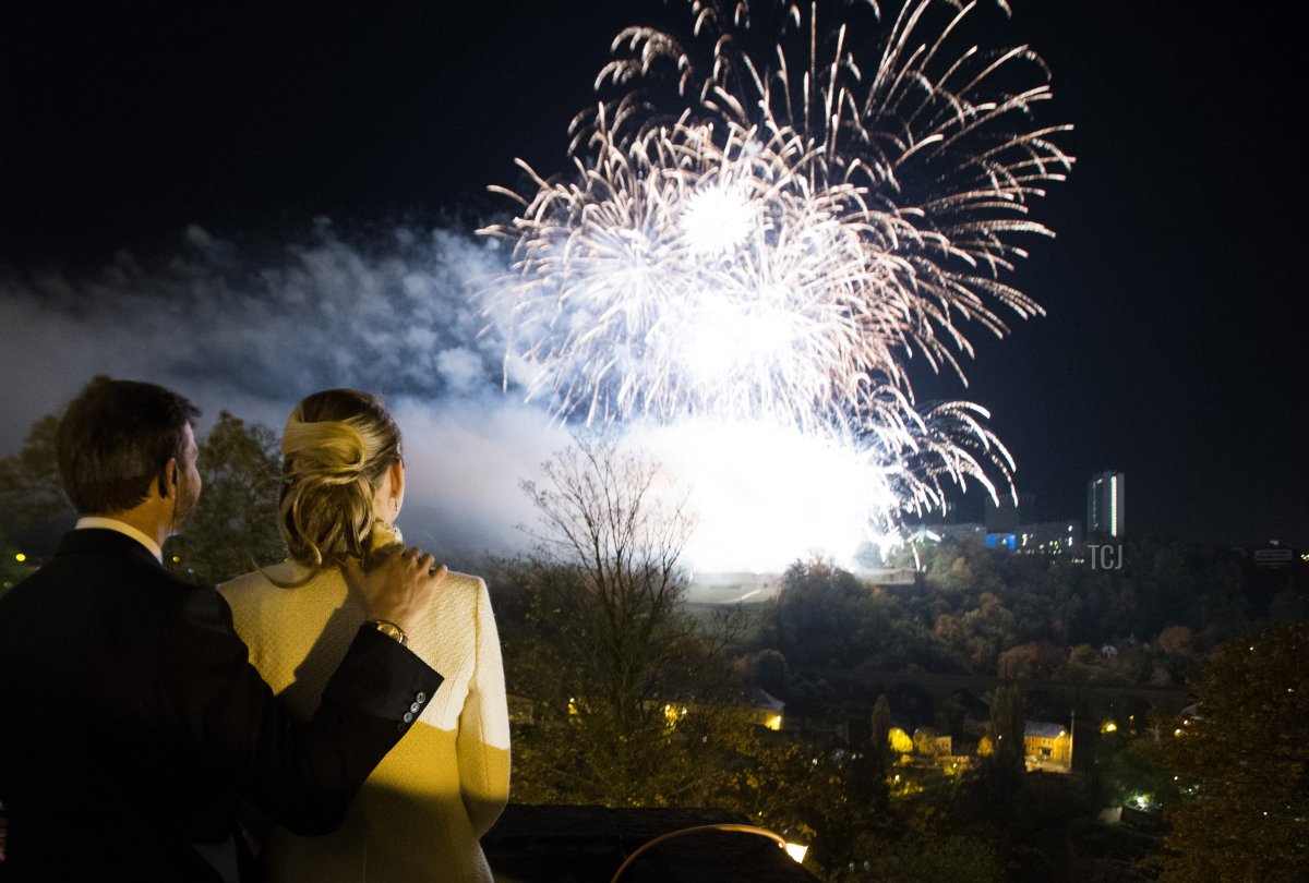 In this handout image provided by the Grand-Ducal Court of Luxembourg, Princess Stephanie of Luxembourg and Prince Guillaume of Luxembourg watch fireworks from the Grand-Ducal Palace after their wedding ceremony at the Cathedral of our Lady of Luxembourg on October 20, 2012 in Luxembourg