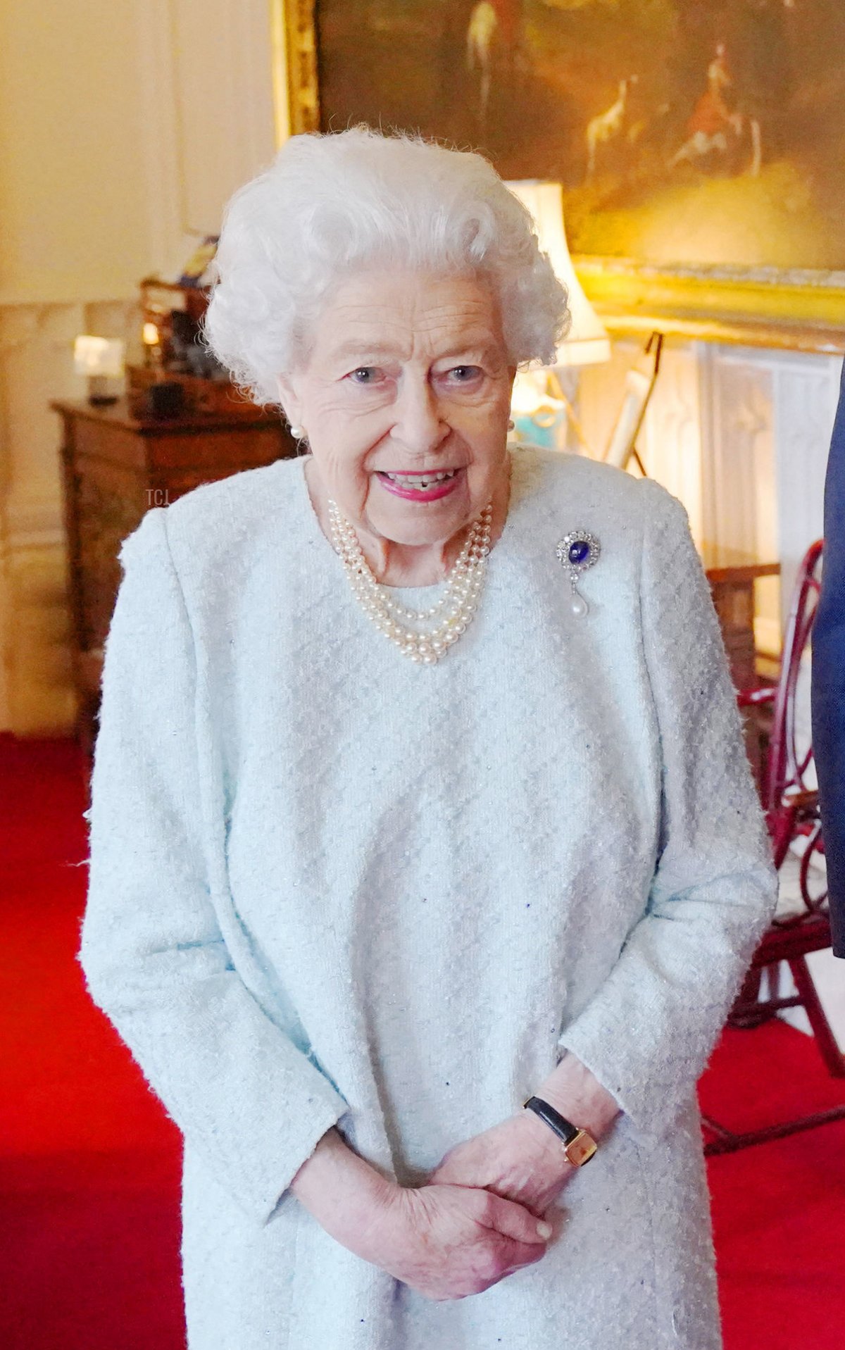 Britain's Queen Elizabeth II poses for a photograph with the Sultan of Oman, Sultan Haitham bin Tariq and his wife, Sayyida Ahad Bint Abdullah Bin Hamad Al Busaidiyah, during an audience at Windsor Castle in Windsor, west of London on December 15, 2021