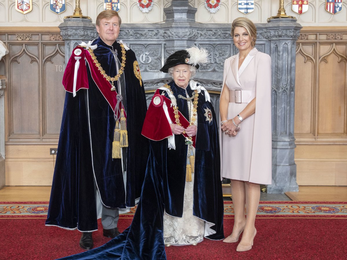 Britain's Queen Elizabeth II (C) poses with with King Willem-Alexander (L) of the Netherlands and his wife, Queen Maxima (R), in St George's Hall, at Windsor Castle, in Windsor, June 17, 2019, after the king was invested as a supernumerary Knight of the Garter, a Stranger Knight of the Garter, ahead of the annual Order of the Garter Service at St George's Chapel