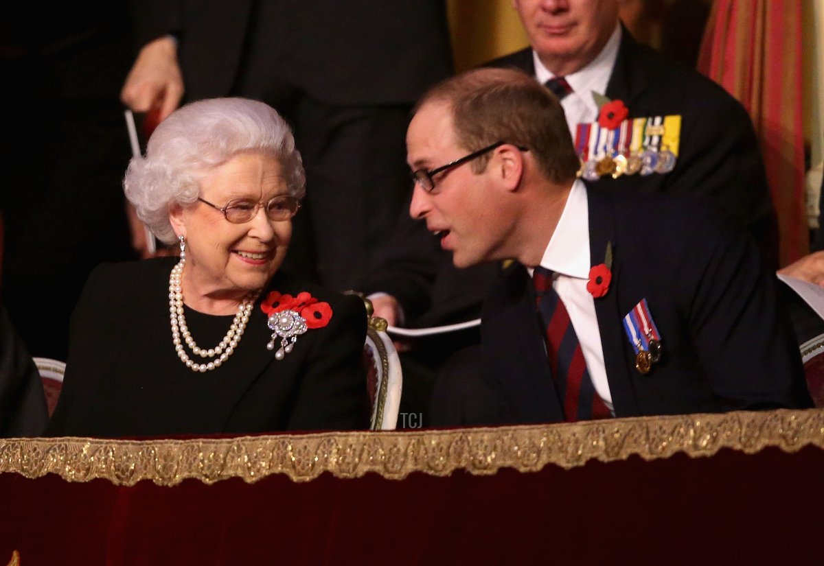 Queen Elizabeth II and Prince William, Duke of Cambridge chat to each other in the Royal Box at the Royal Albert Hall during the Annual Festival of Remembrance on November 7, 2015 in London, England