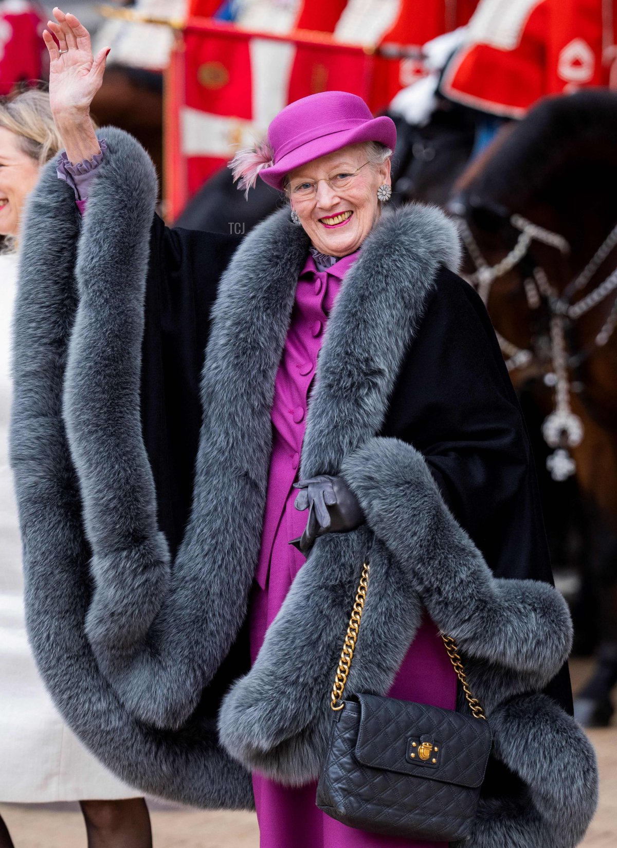 Denmark's Queen Margrethe II (R) waves to onlookers as she is welcomed by Copenhagen's Mayor Sophie Haestorp Andersen (C) at Copenhagen City Hall prior to celebrations of the Queen's 50-year reign, in Copenhagen, Denmark, on November 12, 2022
