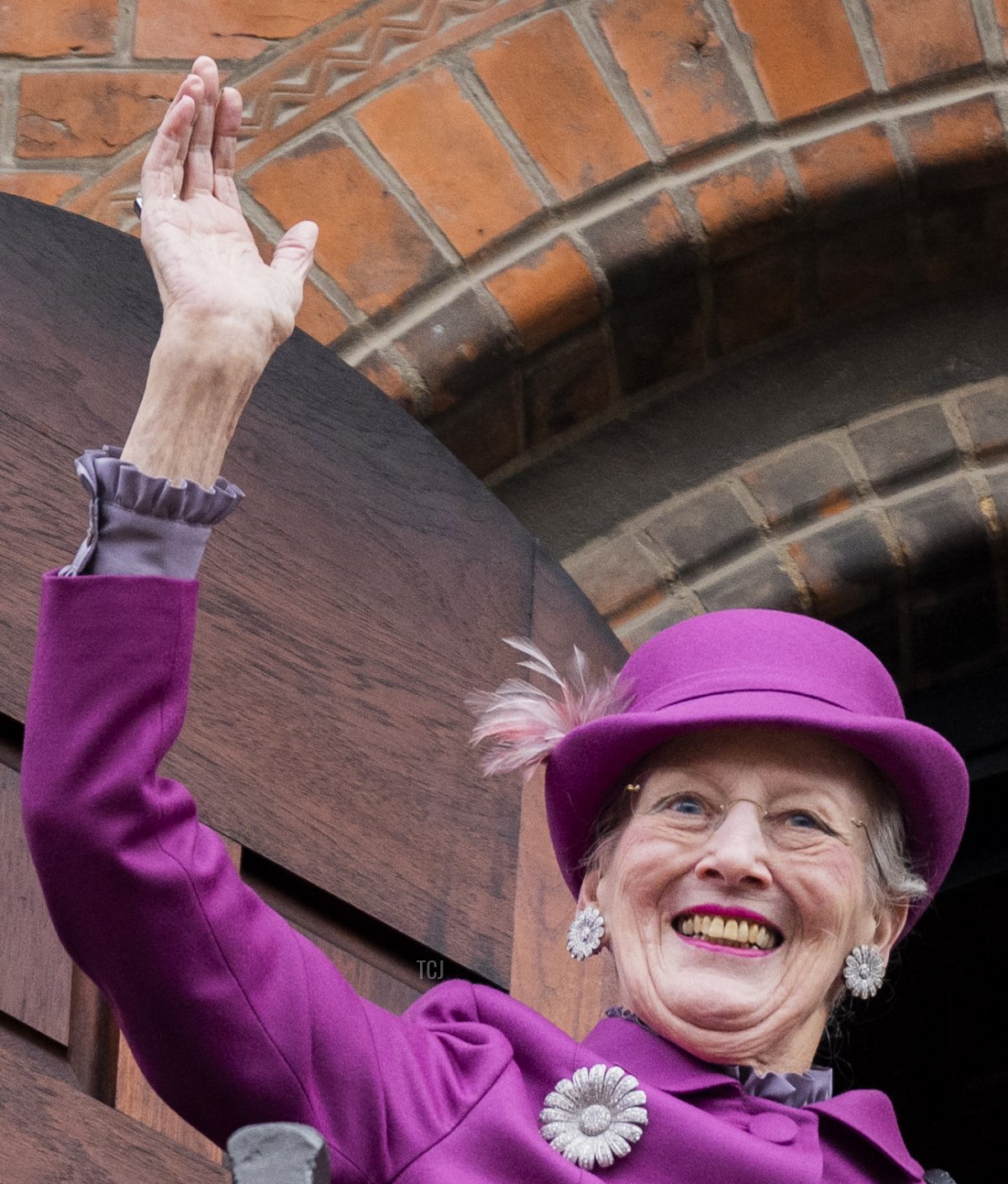 Denmark's Queen Margrethe II waves to onlookers from the balcony of Copenhagen City Hall prior to celebrations of the Queen's 50-year reign, in Copenhagen, Denmark, on November 12, 2022