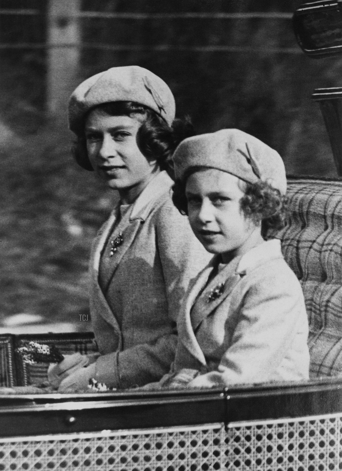 Princess Elizabeth (later Queen Elizabeth II) and Princess Margaret (1930-2002) ride in a carriage with the King and Queen to Crathie Kirk from Balmoral Castle to attend a morning service, Scotland, 9th October 1938