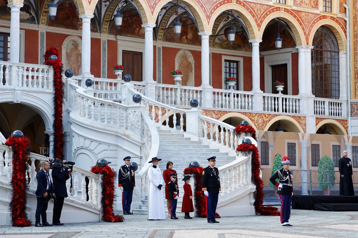 Princess Charlene (4thL), Princess Stephanie, Prince Jacques, Princess Gabriella and Prince Albert II of Monaco attend celebrations as part of ceremonies marking the National Day at the Palace in Monaco on November 19, 2022