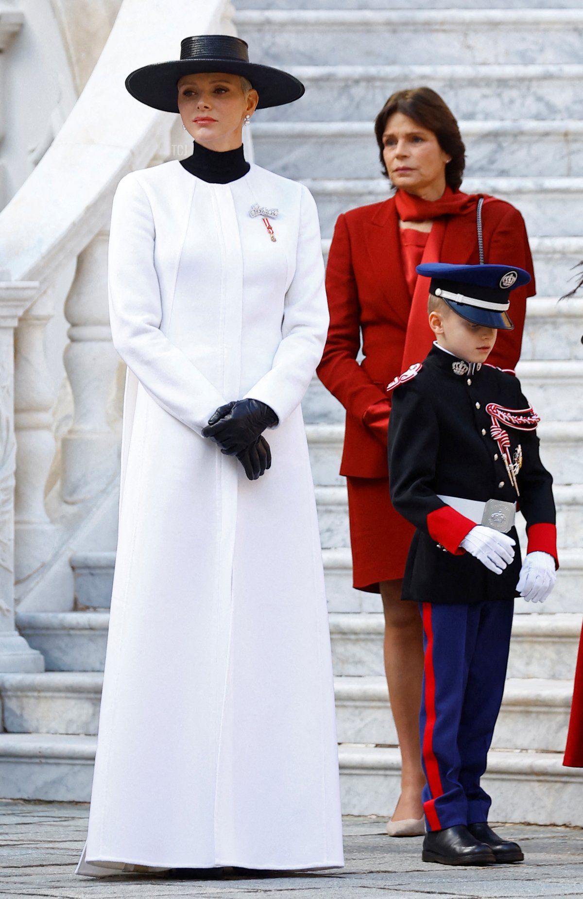 Princess Charlene of Monaco (L), Princess Stephanie of Monaco and Prince Jacques attend celebrations as part of ceremonies marking the National Day at the Palace in Monaco on November 19, 2022