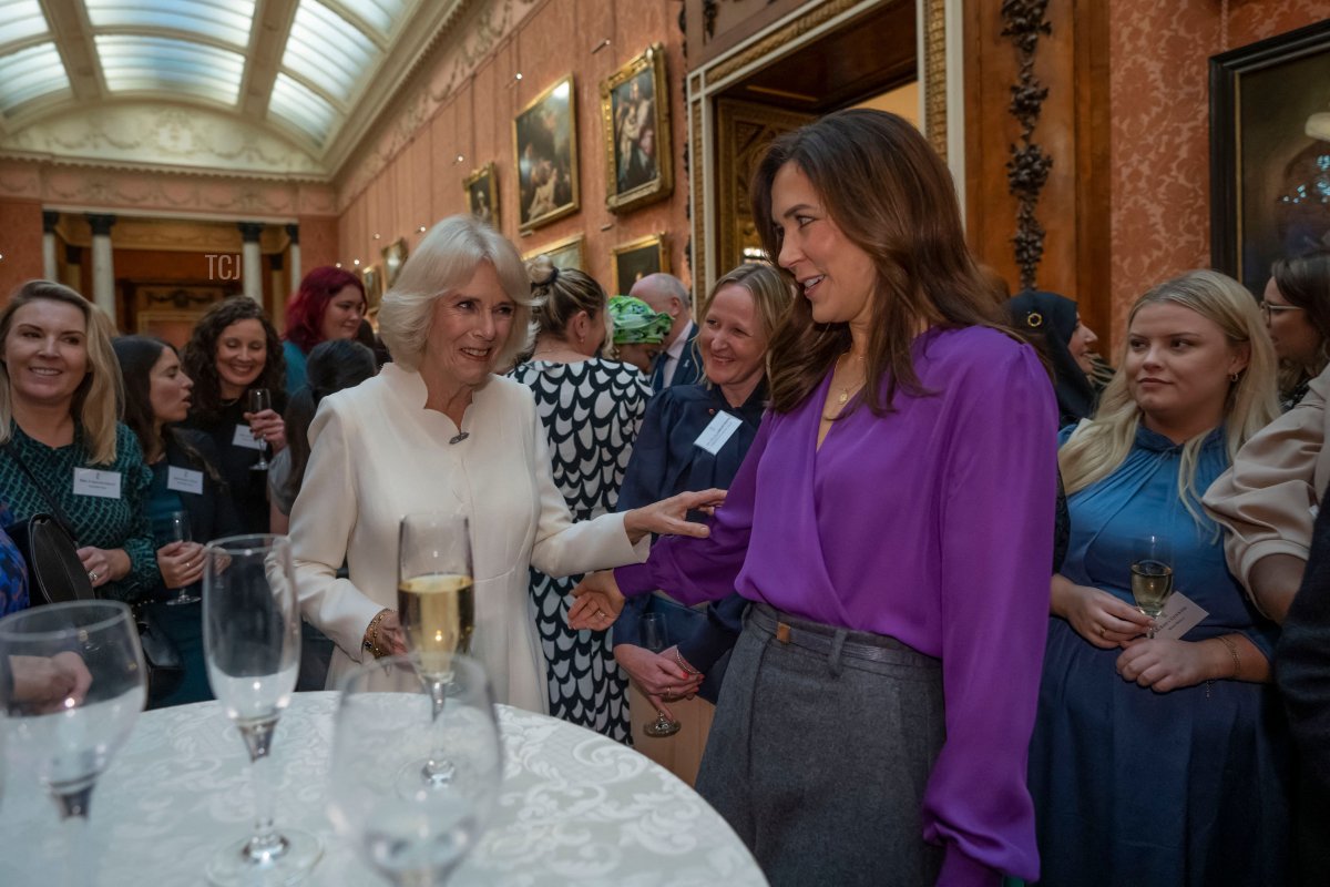 Britain's Queen Consort Camilla speaks to Danish Crown Princess Mary during a reception to raise awareness of violence against women and girls as part of the UN 16 days of Activism against Gender-Based Violence, at Buckingham Palace in London on November 29, 2022