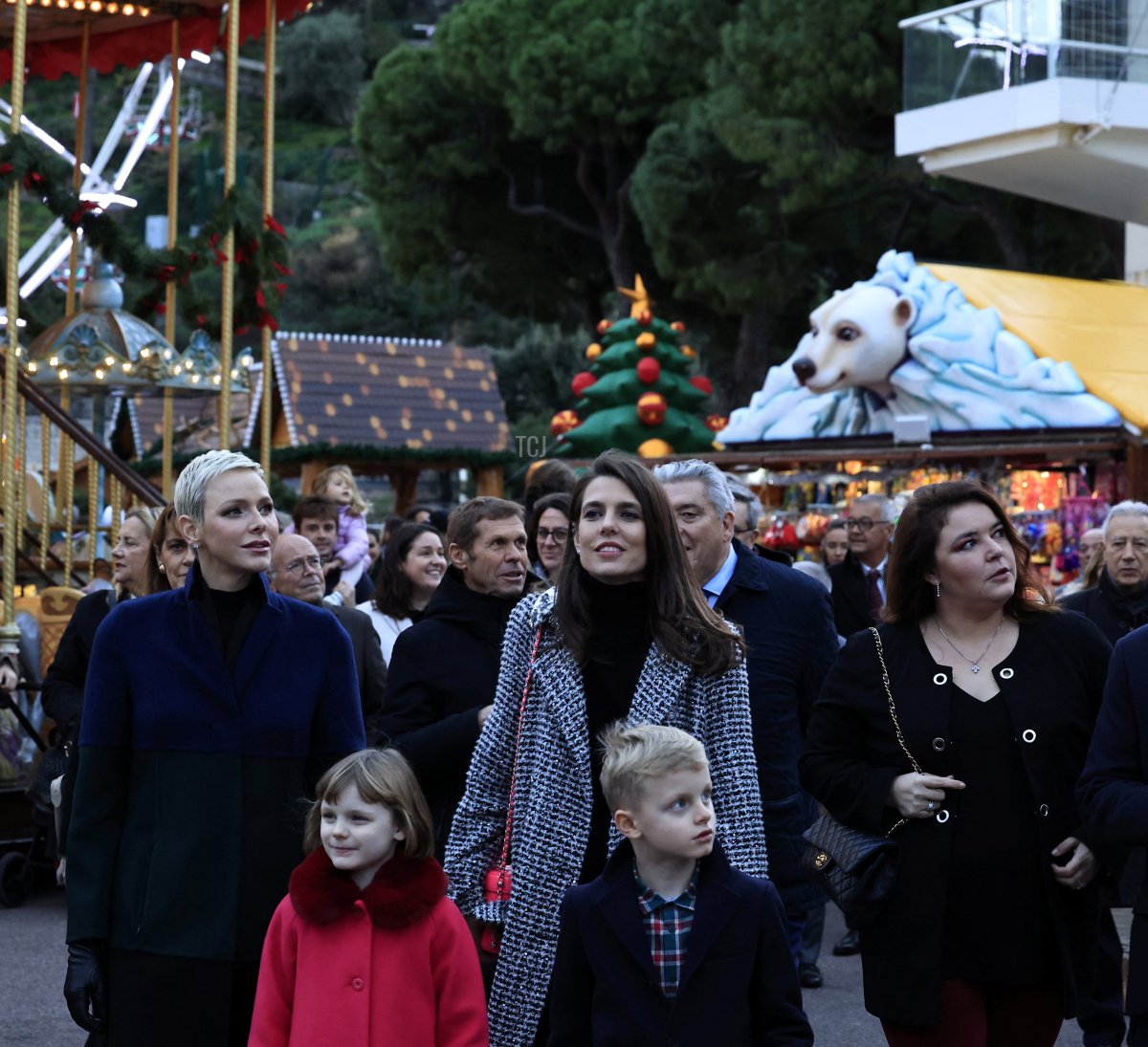 Princess Charlene of Monaco (C,L) Charlotte Casiraghi (C,R) Monaco's Prince Jacques (front C,R) and Princess Gabriella (front C,L) inaugurate the Christmas village in Monaco, on December 2, 2022