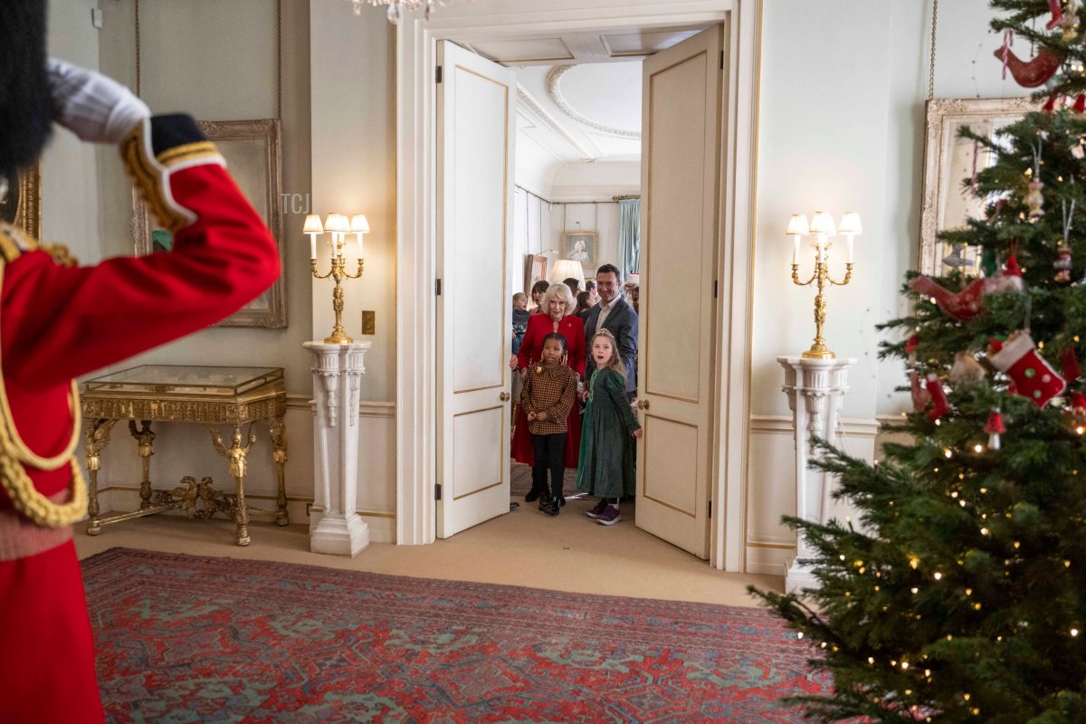 Britain's Camilla, Queen Consort arrives with children during her annual reception for youngsters and their carers from Helen and Douglas House and Roald Dahl's Marvellous Children's Charity to decorate the Christmas tree at Clarence House, in London on December 7, 2022