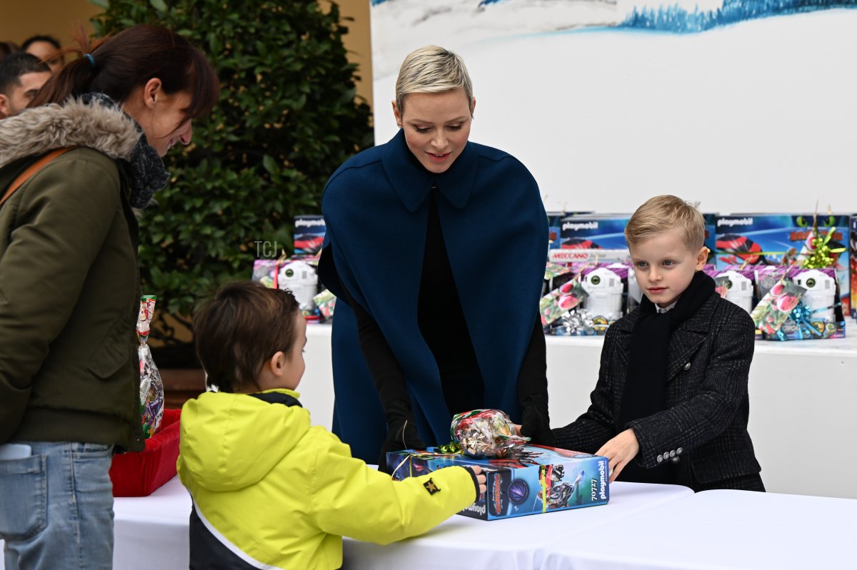 Princess Charlene of Monaco and Prince Jacques of Monaco attend the Christmas Tree at Monaco Palace on December 14, 2022 in Monaco