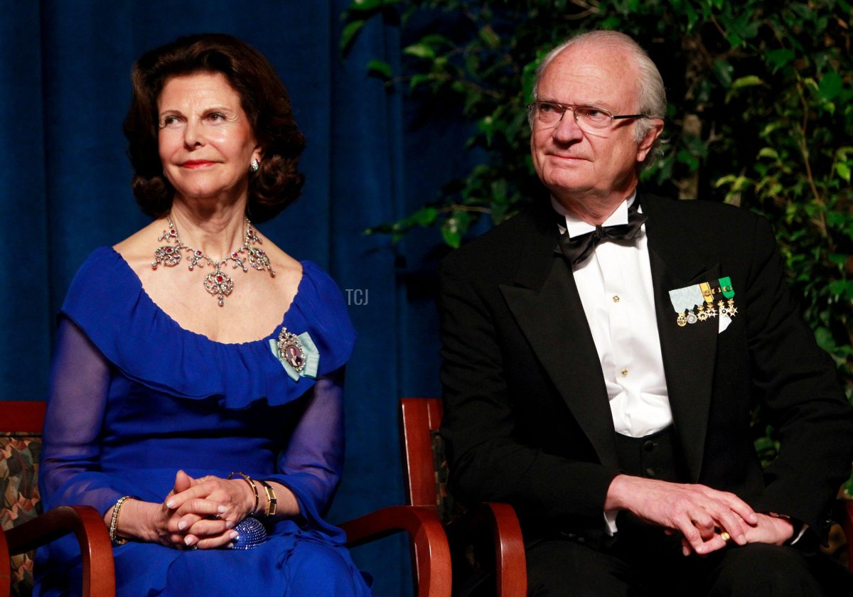 Sweden's King Carl XVI Gustaf (R) and Queen Silvia listen to remarks during a jubilee gala dinner to celebrate the 375th anniversary of the founding of the New Sweden Colony in Wilmington, Delaware May 11, 2013