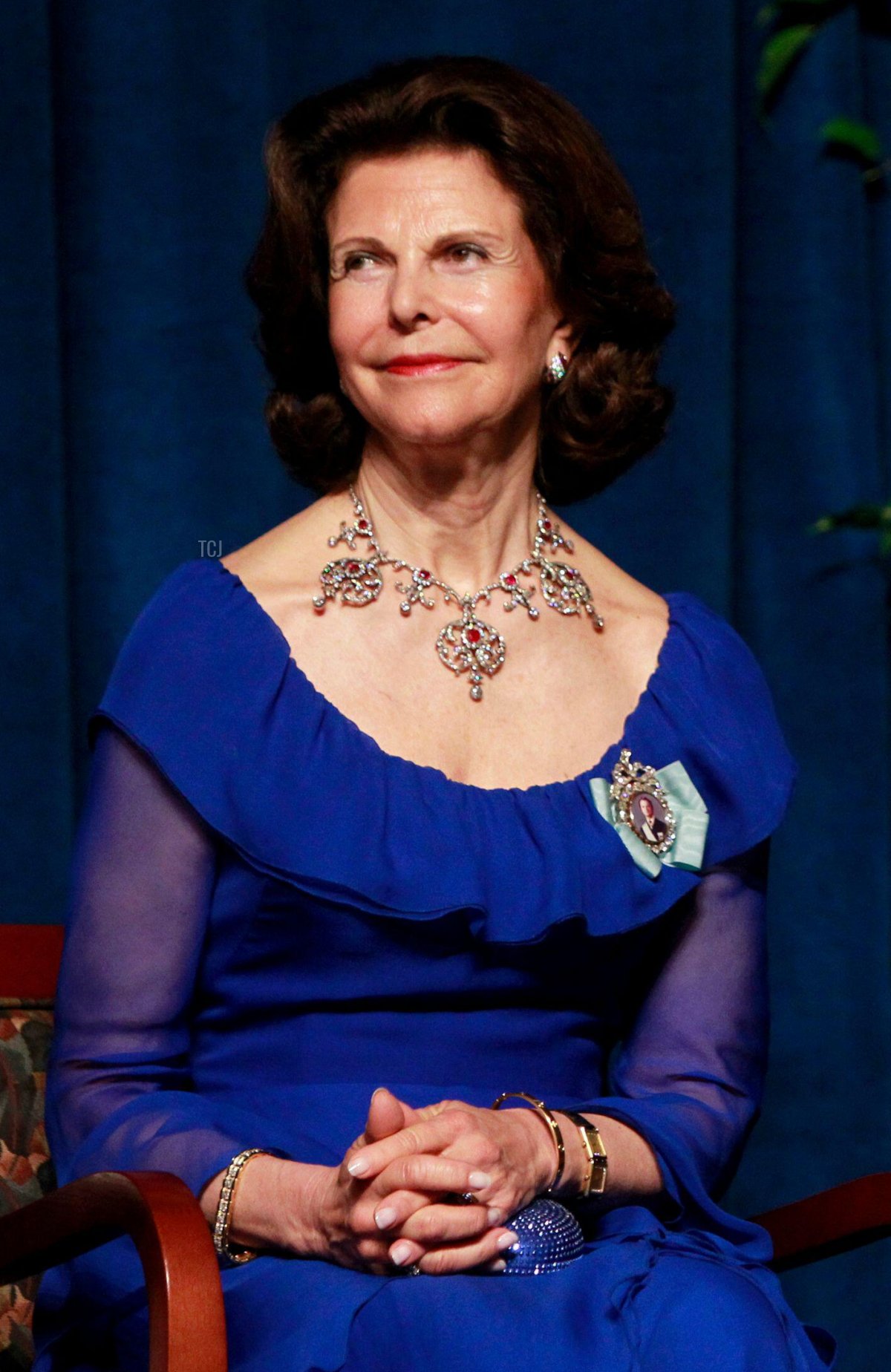 Sweden's King Carl XVI Gustaf (R) and Queen Silvia listen to remarks during a jubilee gala dinner to celebrate the 375th anniversary of the founding of the New Sweden Colony in Wilmington, Delaware May 11, 2013