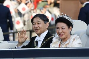 Emperor Naruhito and Empress Masako wave from their car during the imperial parade for enthronement of Emperor Naruhito on November 10, 2019 in Tokyo, Japan (Takashi Aoyama/Getty Images)