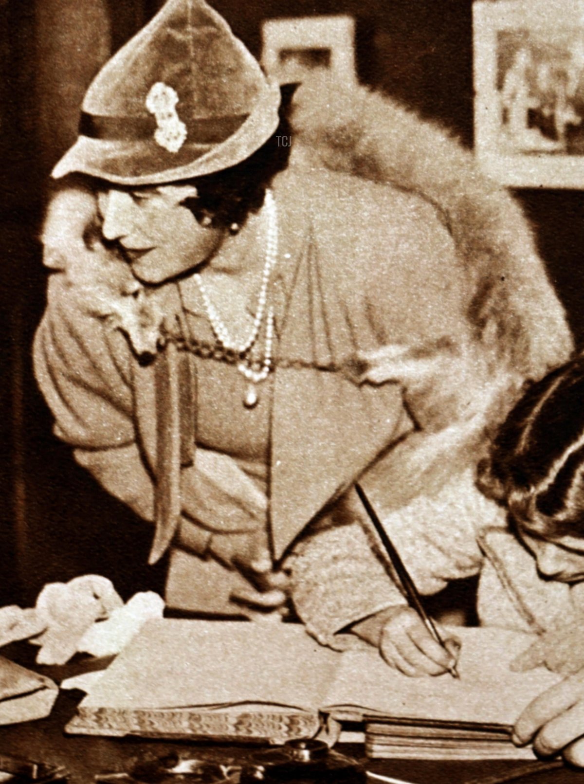 Queen Elizabeth (the Queen Mother) pictured during a visit to the Lord Roberts' Memorial Workshop for Disabled ex-Servicemen, 1936 (World History Archive/Alamy)