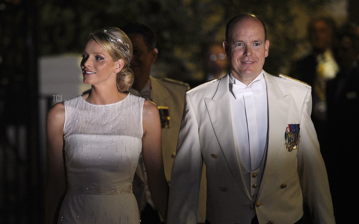 Princess Charlene of Monaco and Prince Albert II of Monaco arrive for a dinner at Opera Terraces after their religious wedding ceremony on July 2, 2011 in Monaco (FRED DUFOUR/AFP via Getty Images)