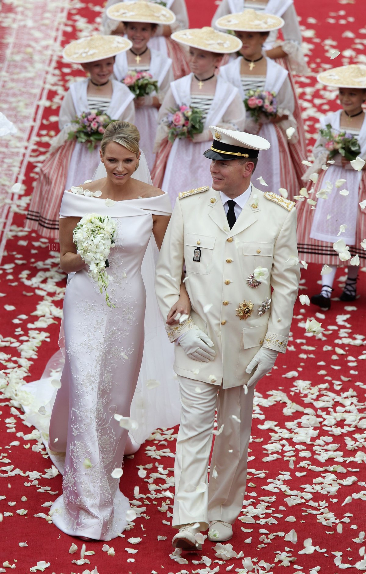Princess Charlene of Monaco and Prince Albert II of Monaco depart following their religious wedding ceremony in the main courtyard at the Prince's Palace on July 2, 2011 in Monaco (Andreas Rentz/Getty Images)