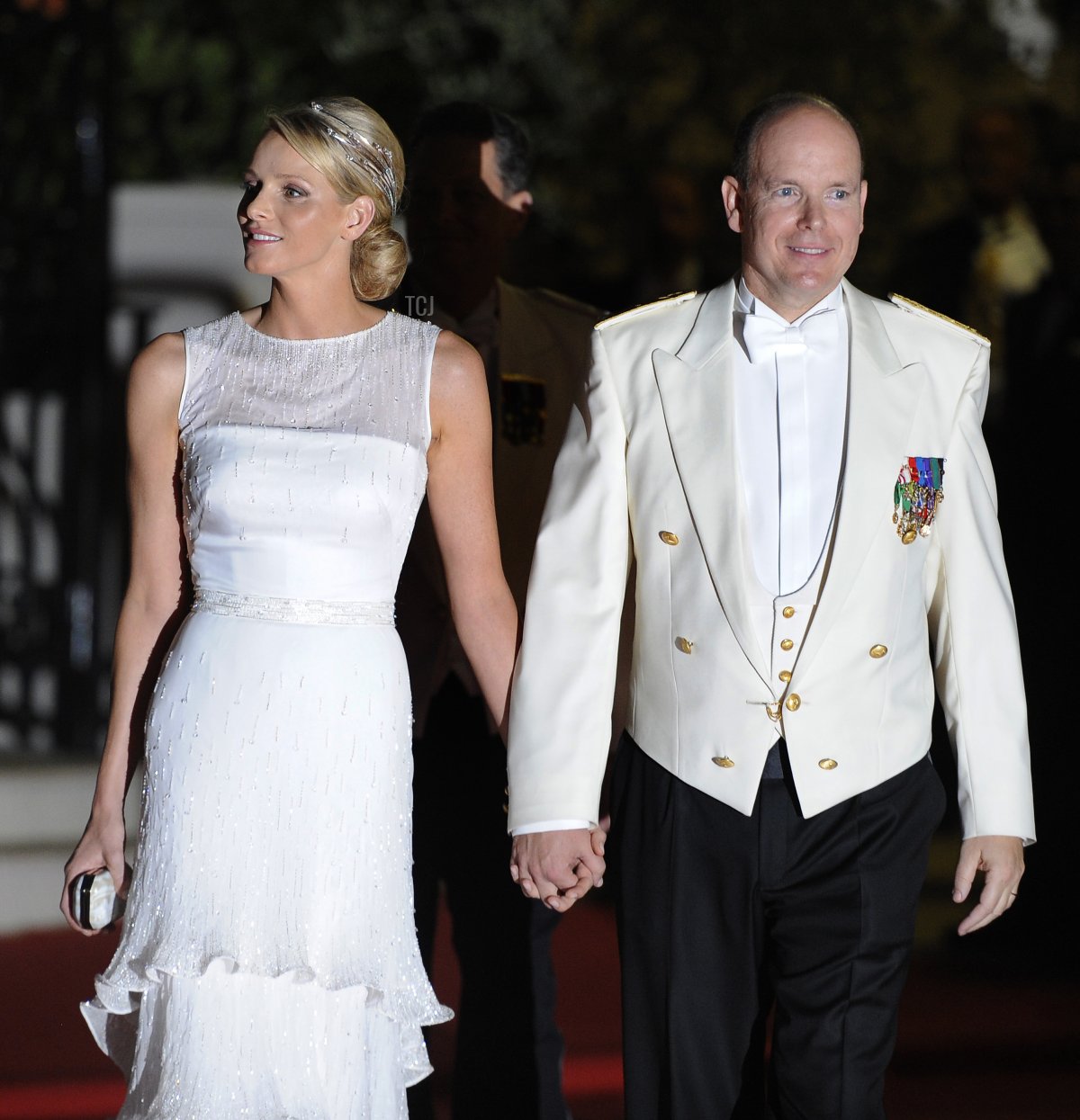 Princess Charlene of Monaco and Prince Albert II of Monaco arrive for a dinner at Opera Terraces after their religious wedding ceremony on July 2, 2011 in Monaco (FRED DUFOUR/AFP via Getty Images)