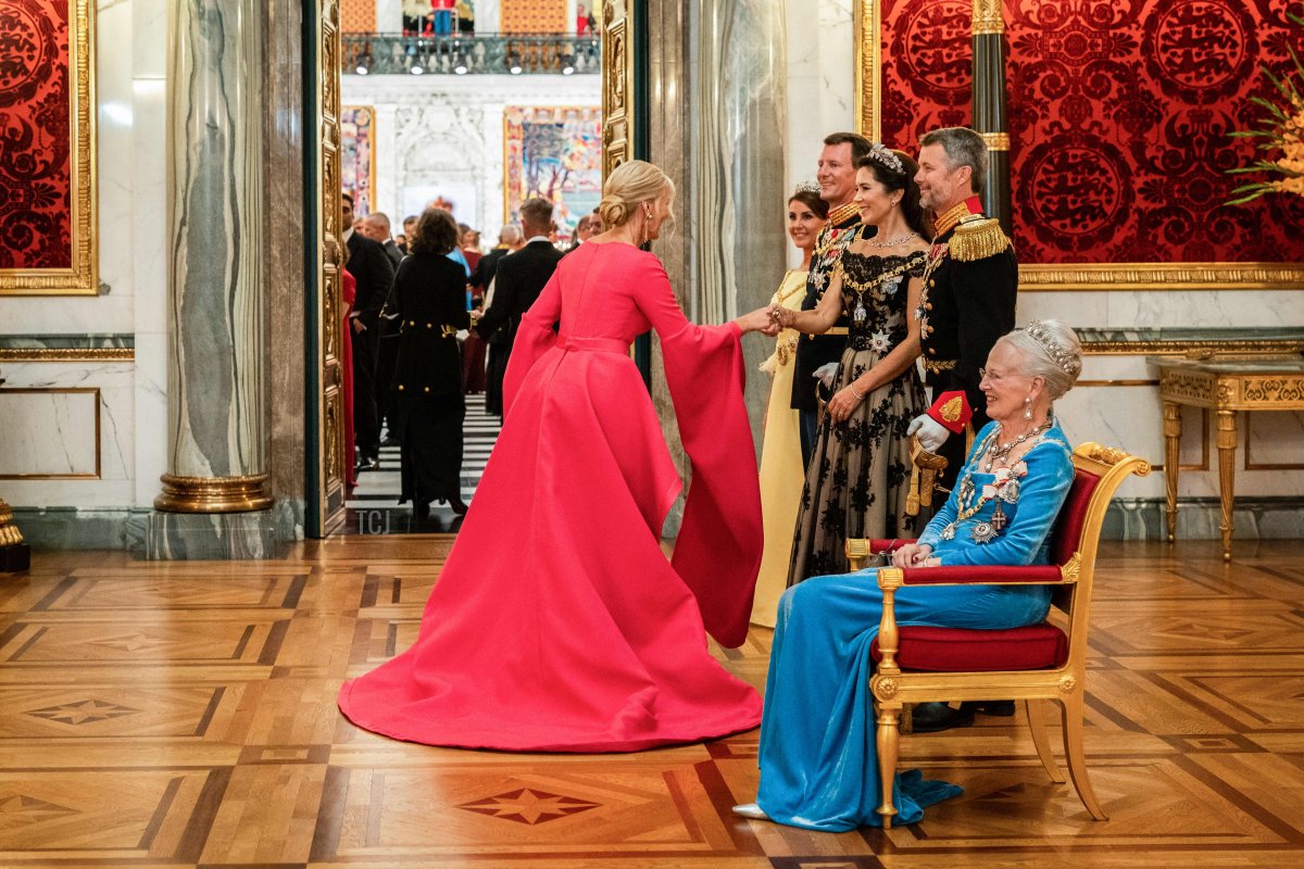 Queen Margrethe II of Denmark, with Crown Prince Frederik, Crown Princess Mary, Prince Joachim, and Princess Marie, welcomes former Prime Minister Helle Thorning-Schmidt at the gala banquet at Christiansborg Palace on September 11, 2022, during the celebrations to mark the 50th anniversary of the Queen of Denmark's accession to the throne (IDA MARIE ODGAARD/Ritzau Scanpix/AFP via Getty Images)