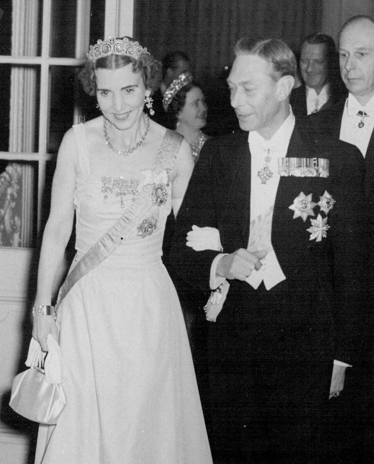 King George VI of the United Kingdom, accompanied by Queen Ingrid of Denmark, leaving the Banquet Hall at the Danish Embassy, May 1951 (Daily Mail/Sydney Morning Herald/SuperStock/Alamy)