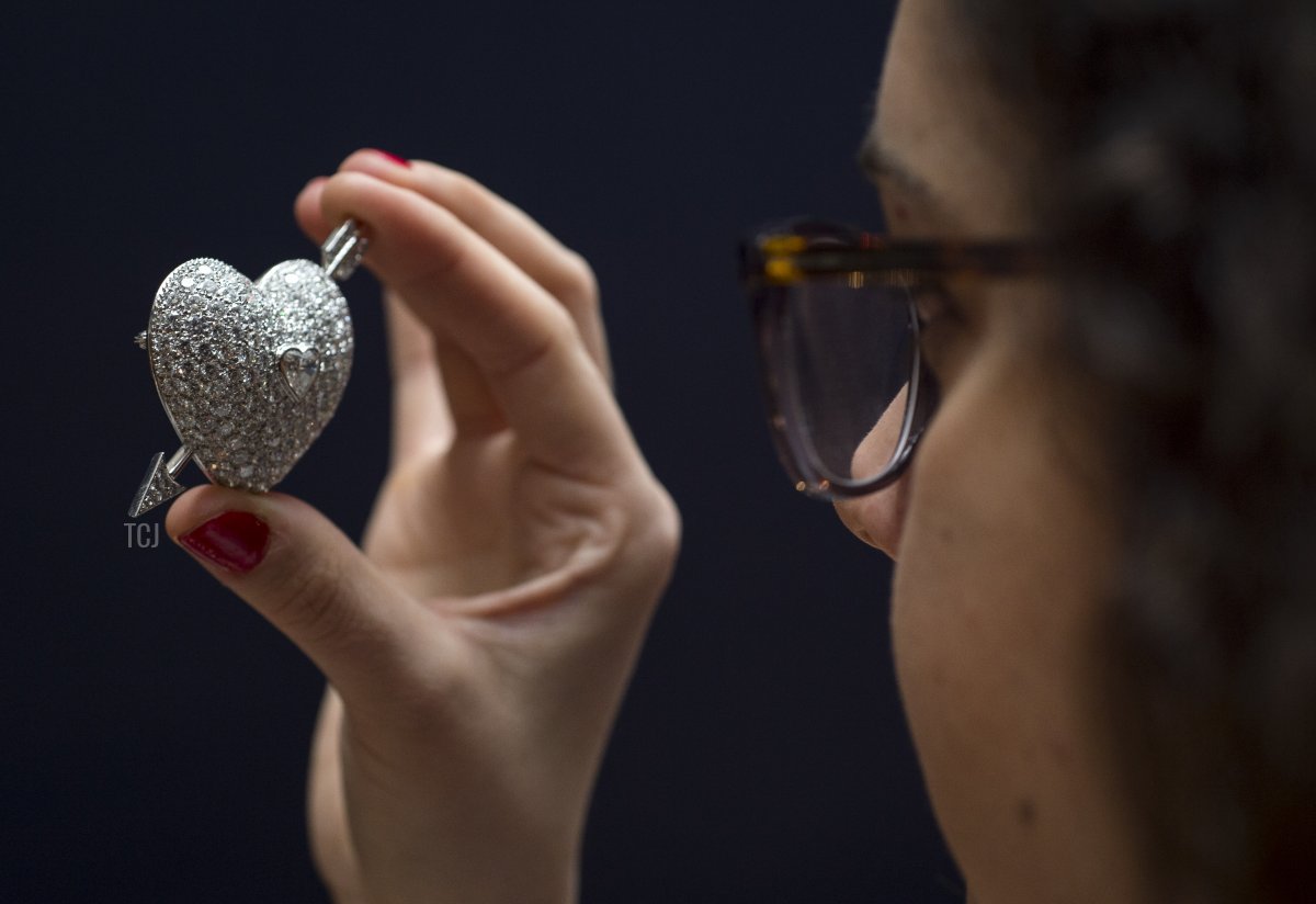 A member of Sotheby's staff holds a diamond brooch given to the Duchess by her husband Andrew Cavendish, 11th Duke of Devonshire to mark their diamond wedding anniversary in 2001 during a behind the scenes look at the personal collection of Deborah Cavendish, Duchess of Devonshire ahead of Sotheby's exhibition and sale on February 26, 2016 in London, England (Justin Setterfield/Getty Images)