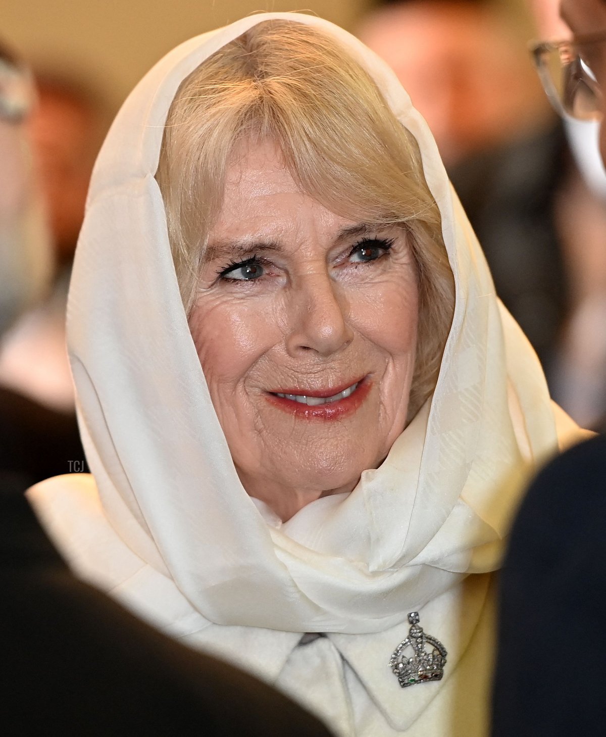 Queen Camilla smiles during a visit Brick Lane Mosque in east London on February 8, 2023 (EDDIE MULHOLLAND/POOL/AFP via Getty Images)